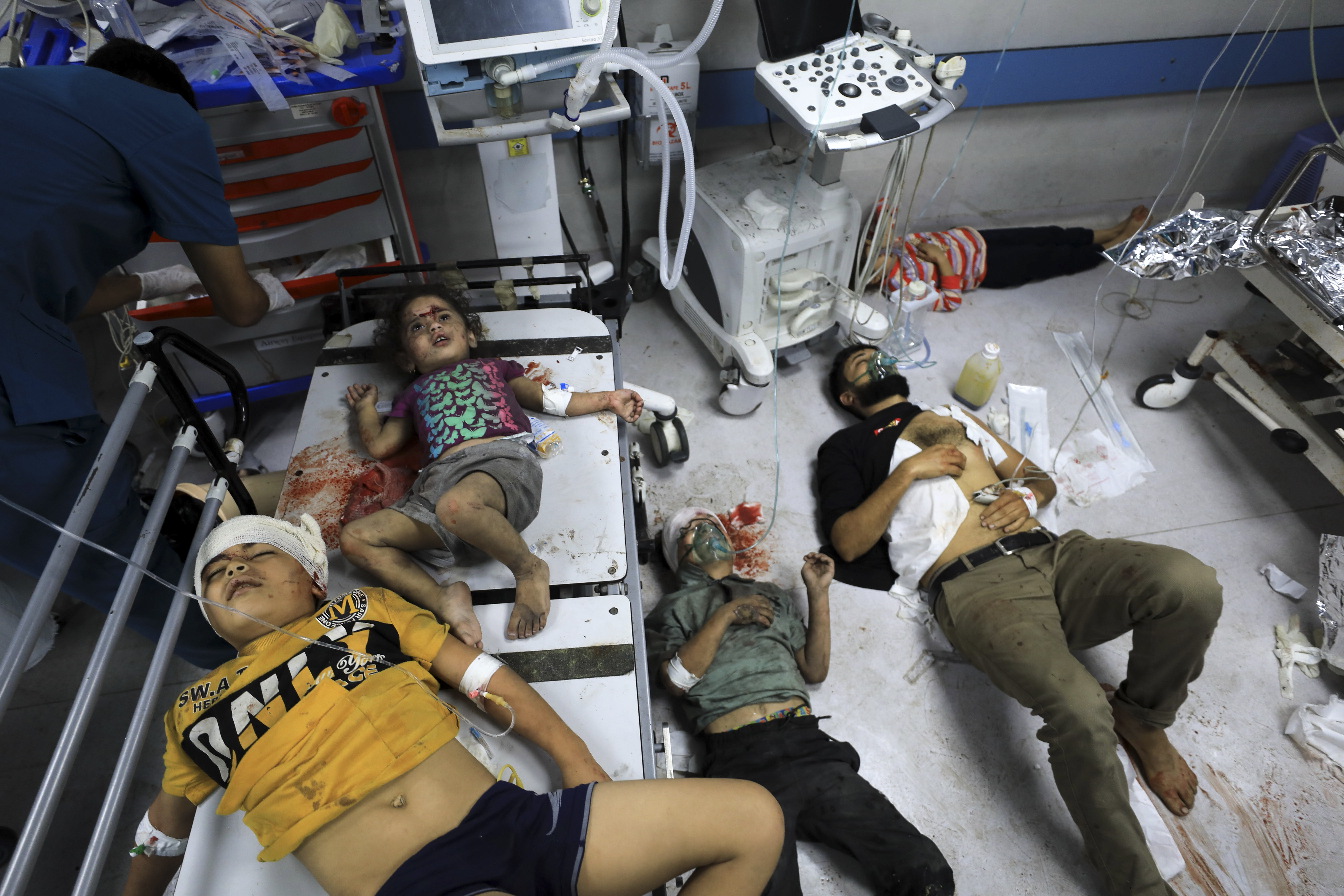 Palestinians wounded in the Israeli bombardment wait for treatment in Al-Shifa Hospital in Gaza City. Photo / AP