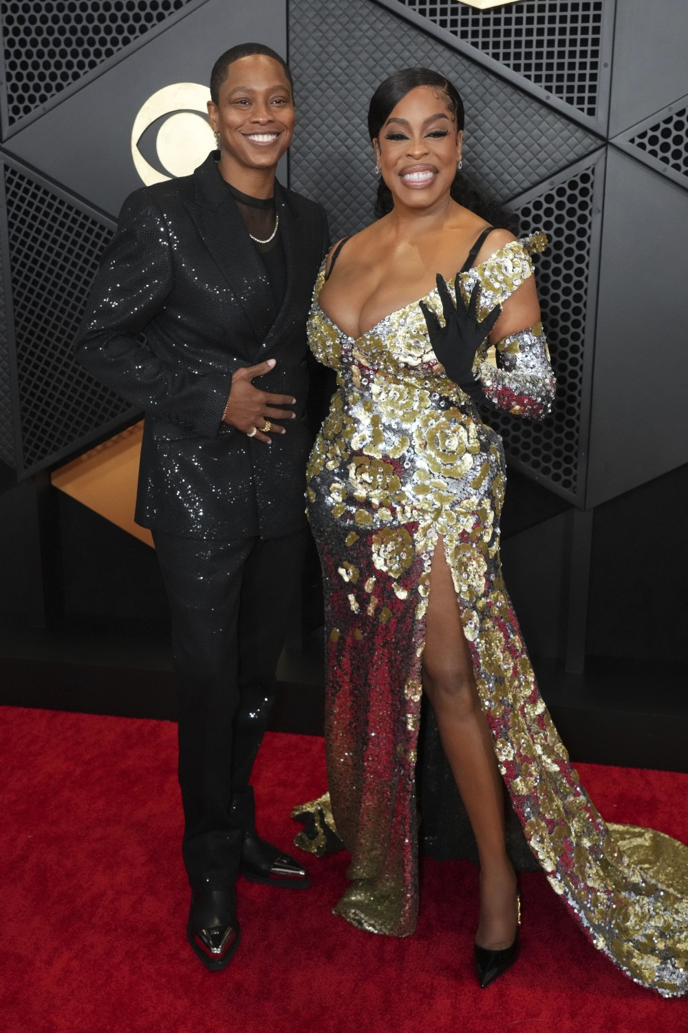 Jessica Betts and Niecy Nash arrive at the 66th annual Grammy Awards in Los Angeles. Photo /  Jordan Strauss, AP