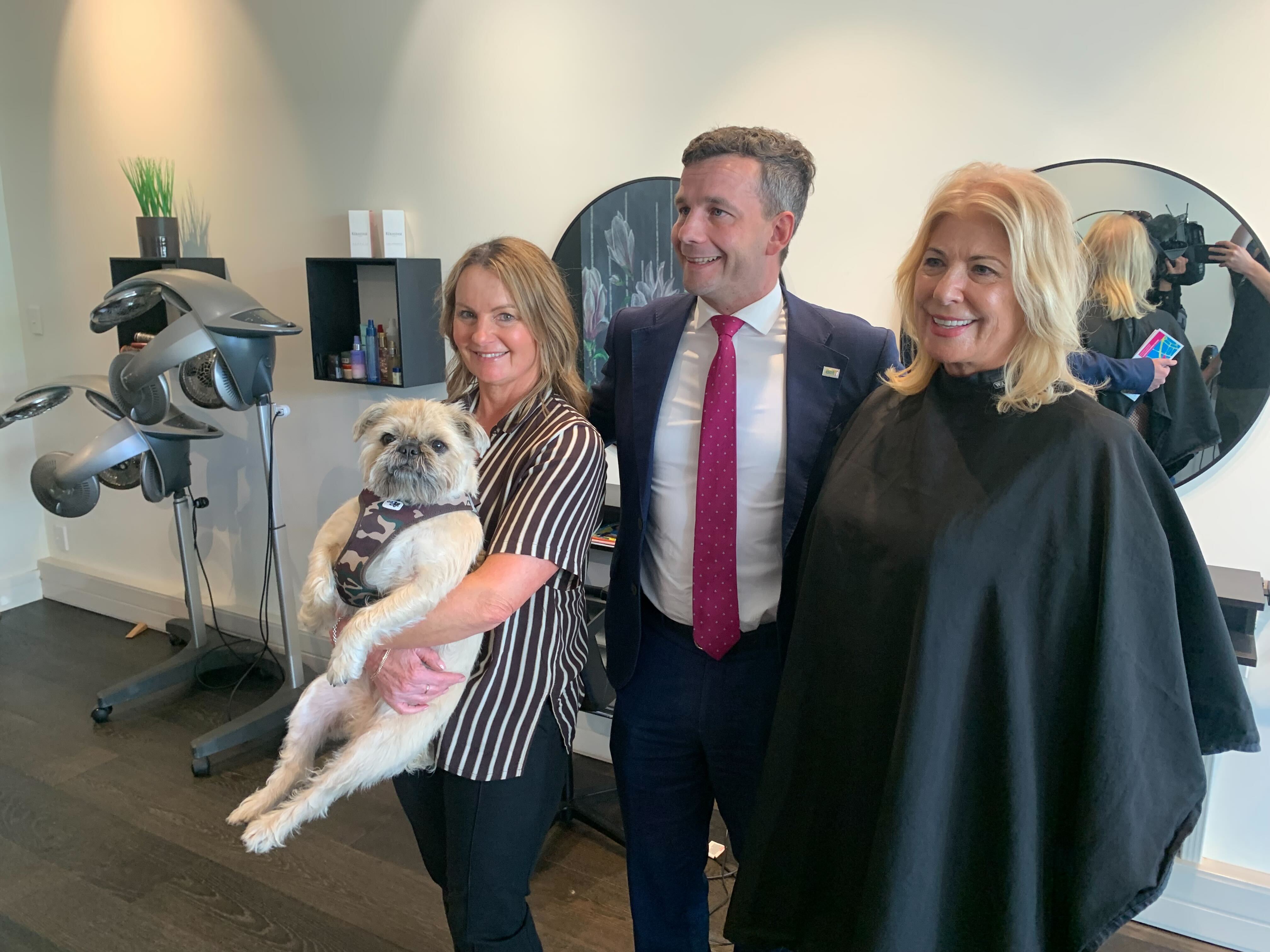 Act Party leader David Seymour takes a photo in a salon while on a walkabout. Photo / Adam Pearse