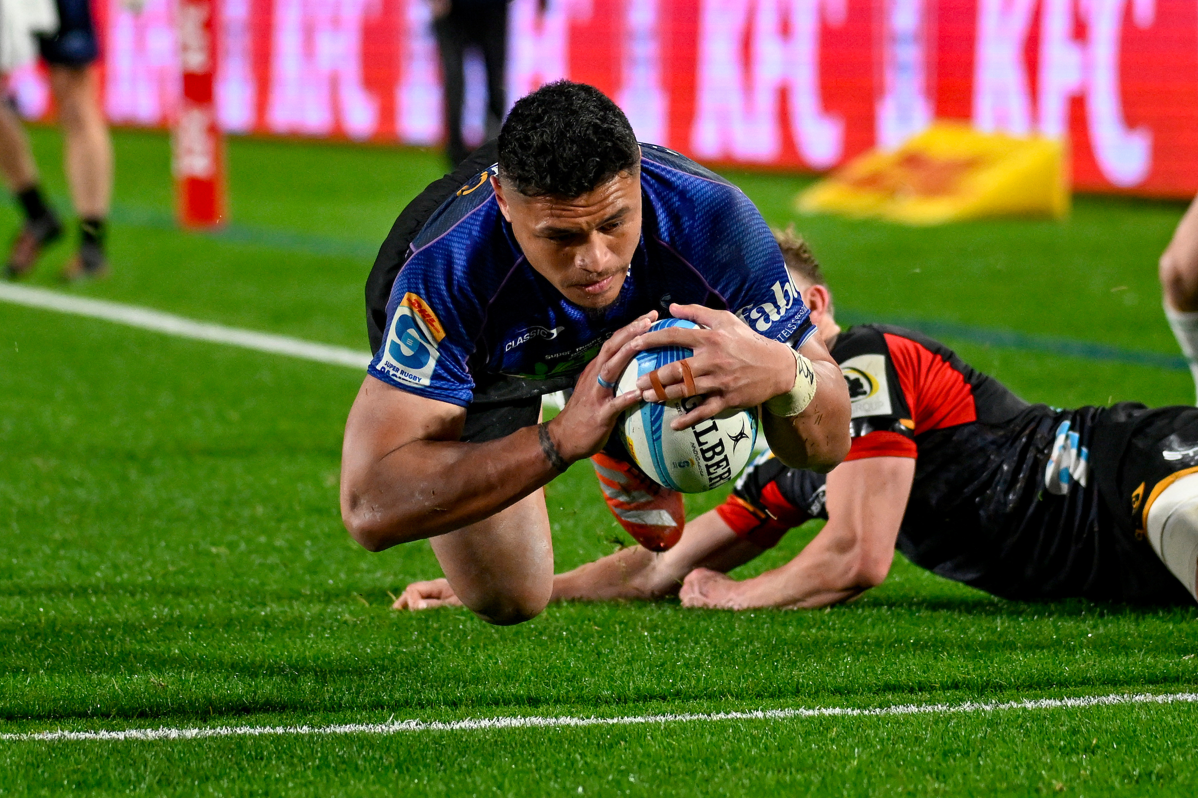 Caleb Clarke of the Blues dives for the try line at Eden Park on June 22, 2024. Photo / Andrew Cornaga / Photosport