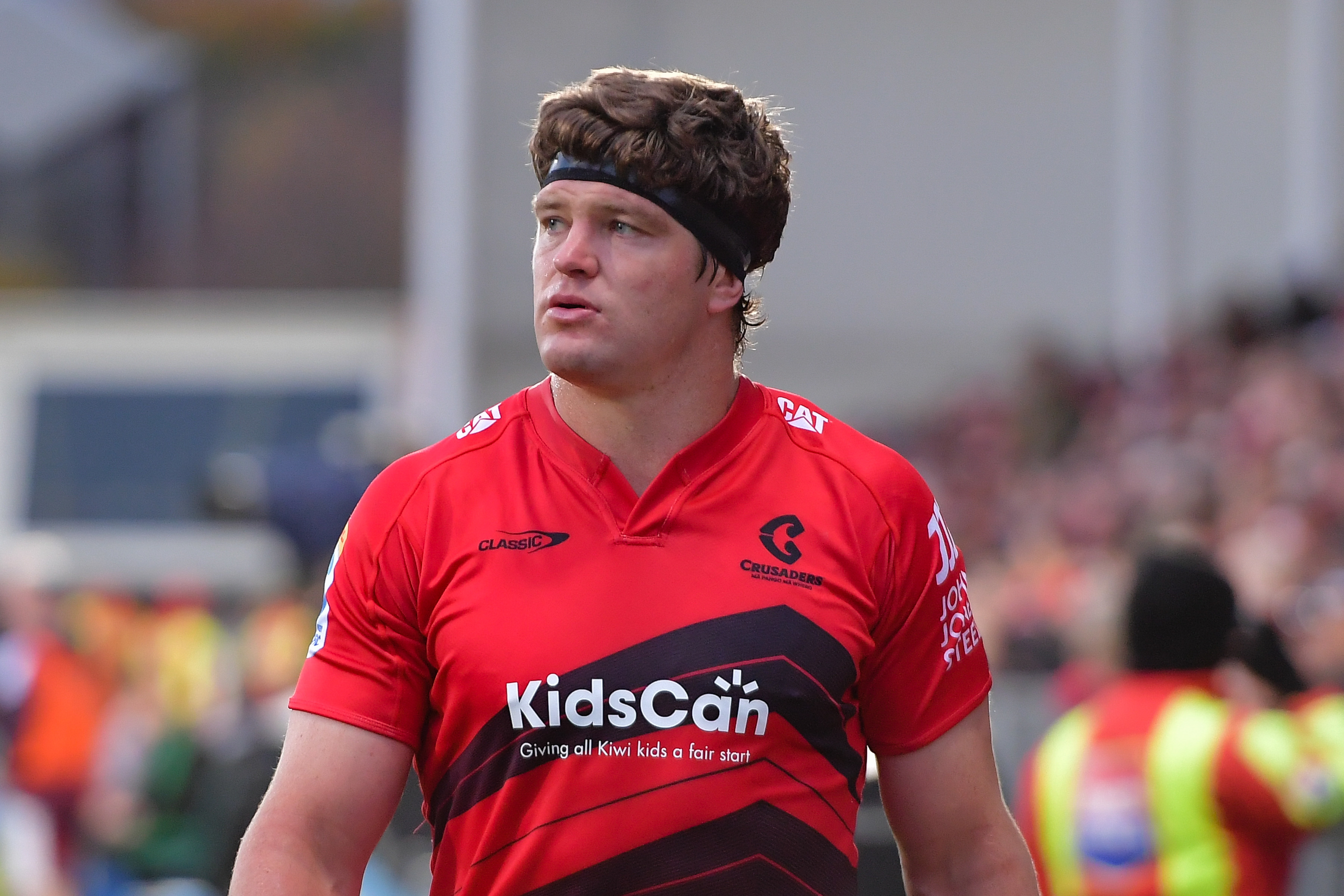 Scott Barrett leaves the field injured during the Crusaders' loss to the Reds. Photo / Photosport