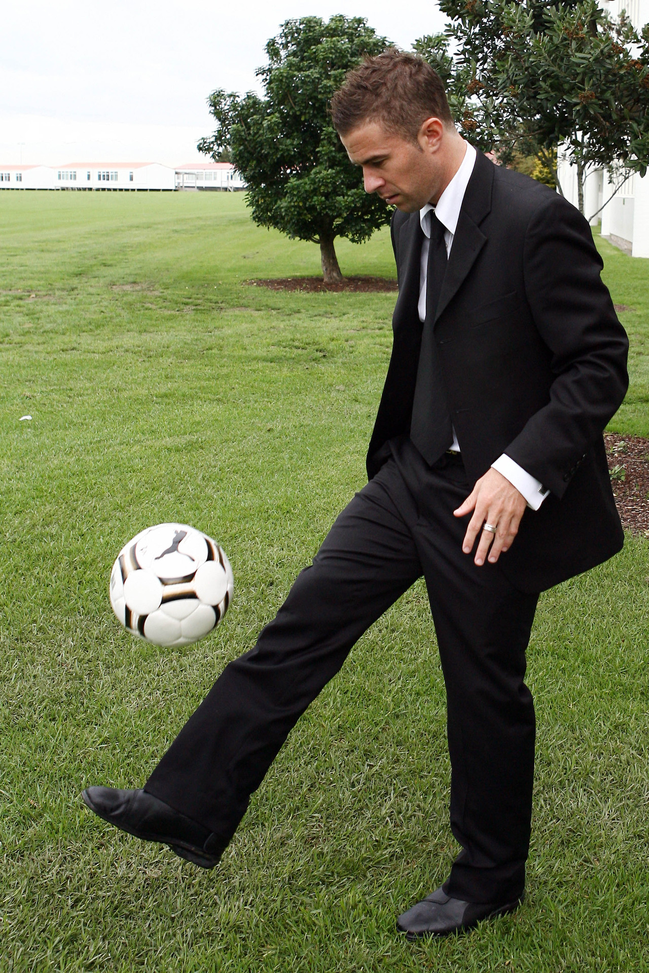 Transitioning: Hickey in May 2007 on the day he retired from the All Whites and embarked on a business career. His outfit changed, but he couldn't immediately let go of the ball. Photo / Wayne Drought
