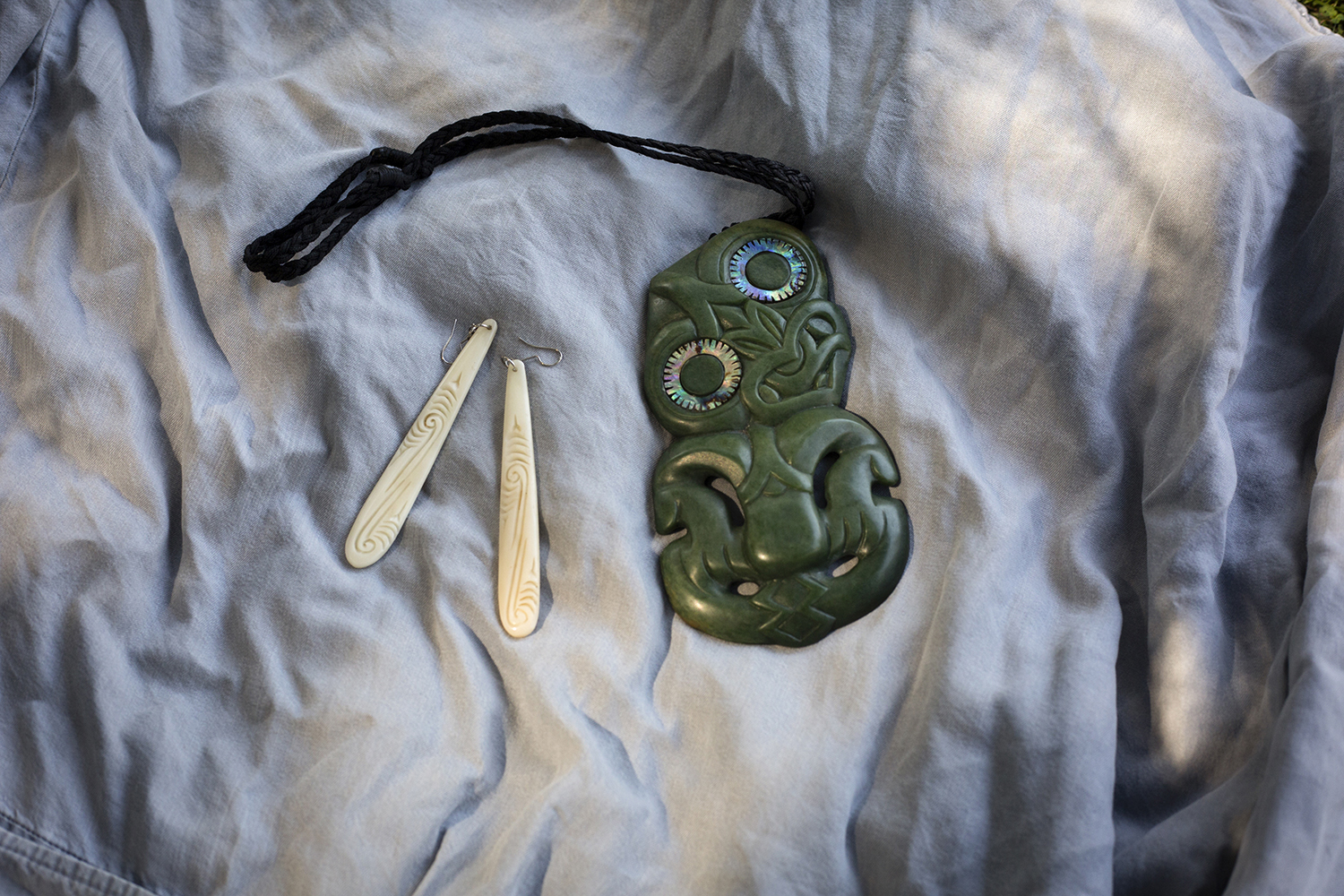 Debbie Ngarewa-Packer’s jade earrings and a hei-tiki, are part of her political message. Photo / Ruth Mcdowall, The New York Times