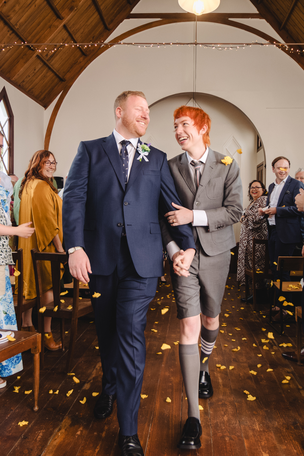 Conrad Reyners (left) and Phillip von Fury were married at Kakanui Church in coastal Otago, a 150-year-old building designed by architect Robert Lawson. Photo / Sara Tansy