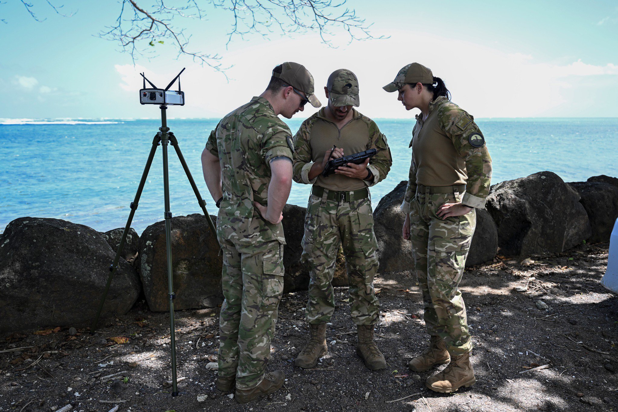RNZAF Security Force get ready to fly a drone to survey the wreck site of HMNZS Manawanui off the Southern Coast of Upulo. Photo / Sergeant Vanessa Parker