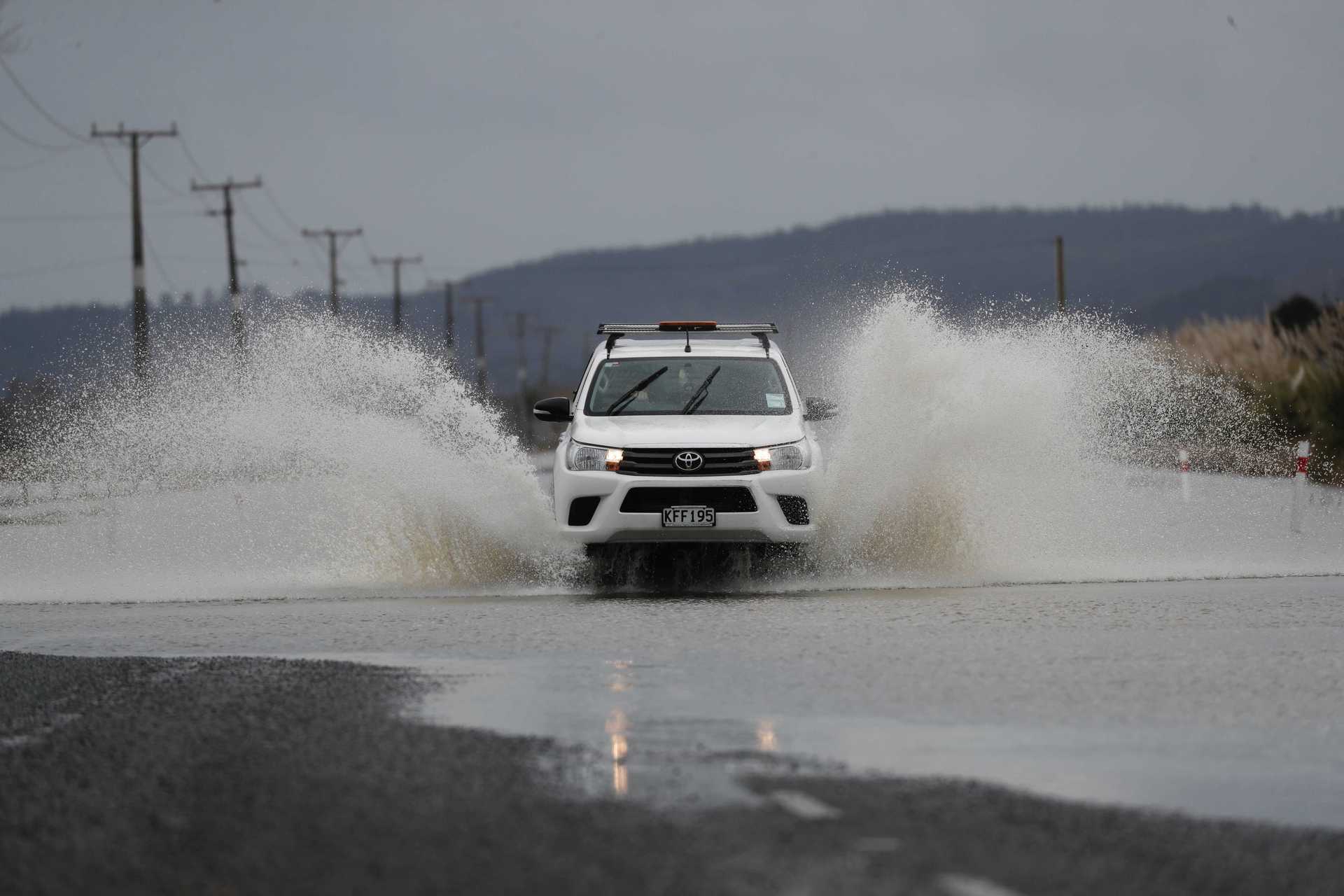 Floodwaters are still causing trouble in the West Auckland area. Photo / Dean Purcell 