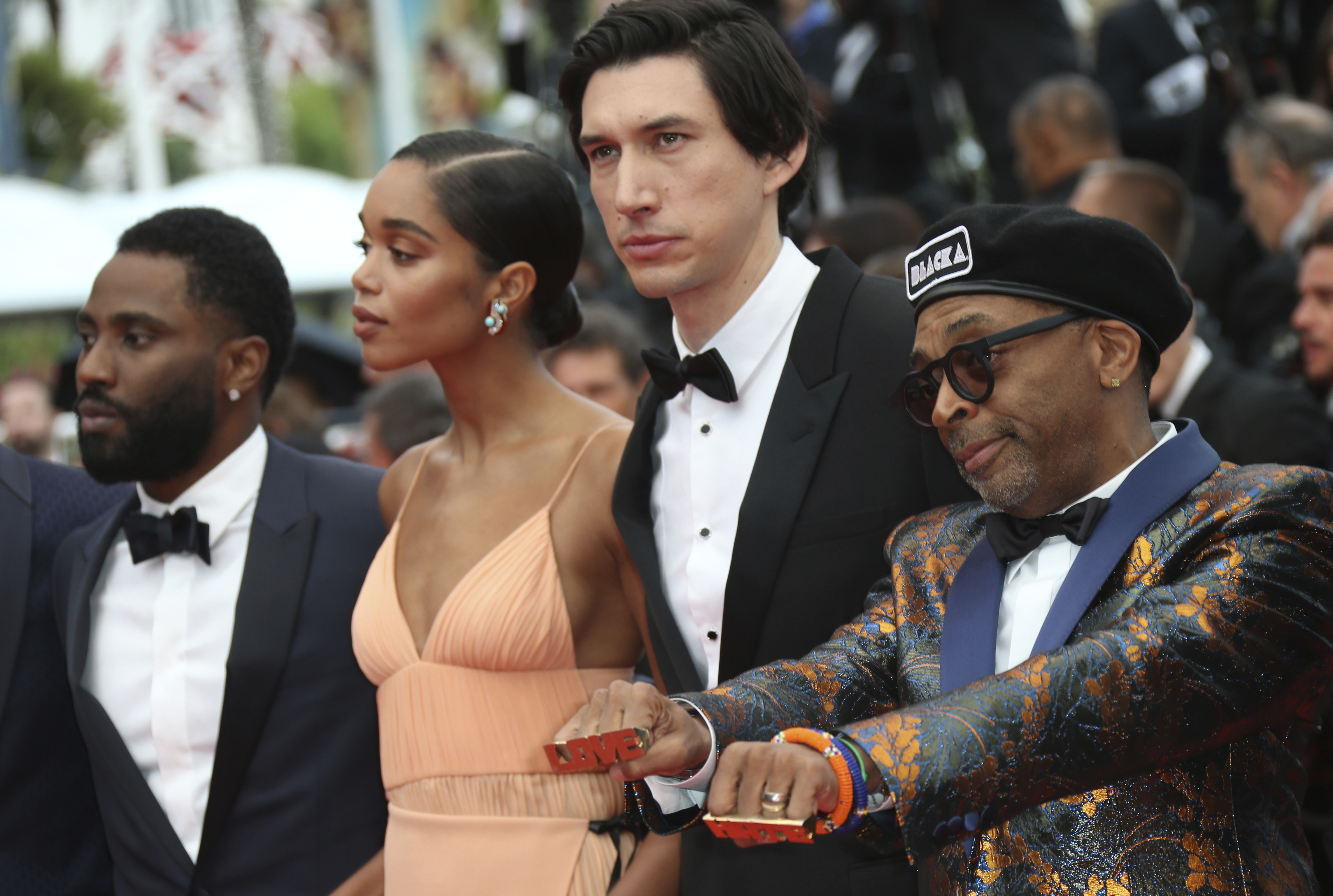 Actors John David Washington, from left, Laura Harrier, Adam Driver, and director Spike Lee pose for photographers upon arrival at the premiere of the film 'BlacKkKlansman' at the 71st international f