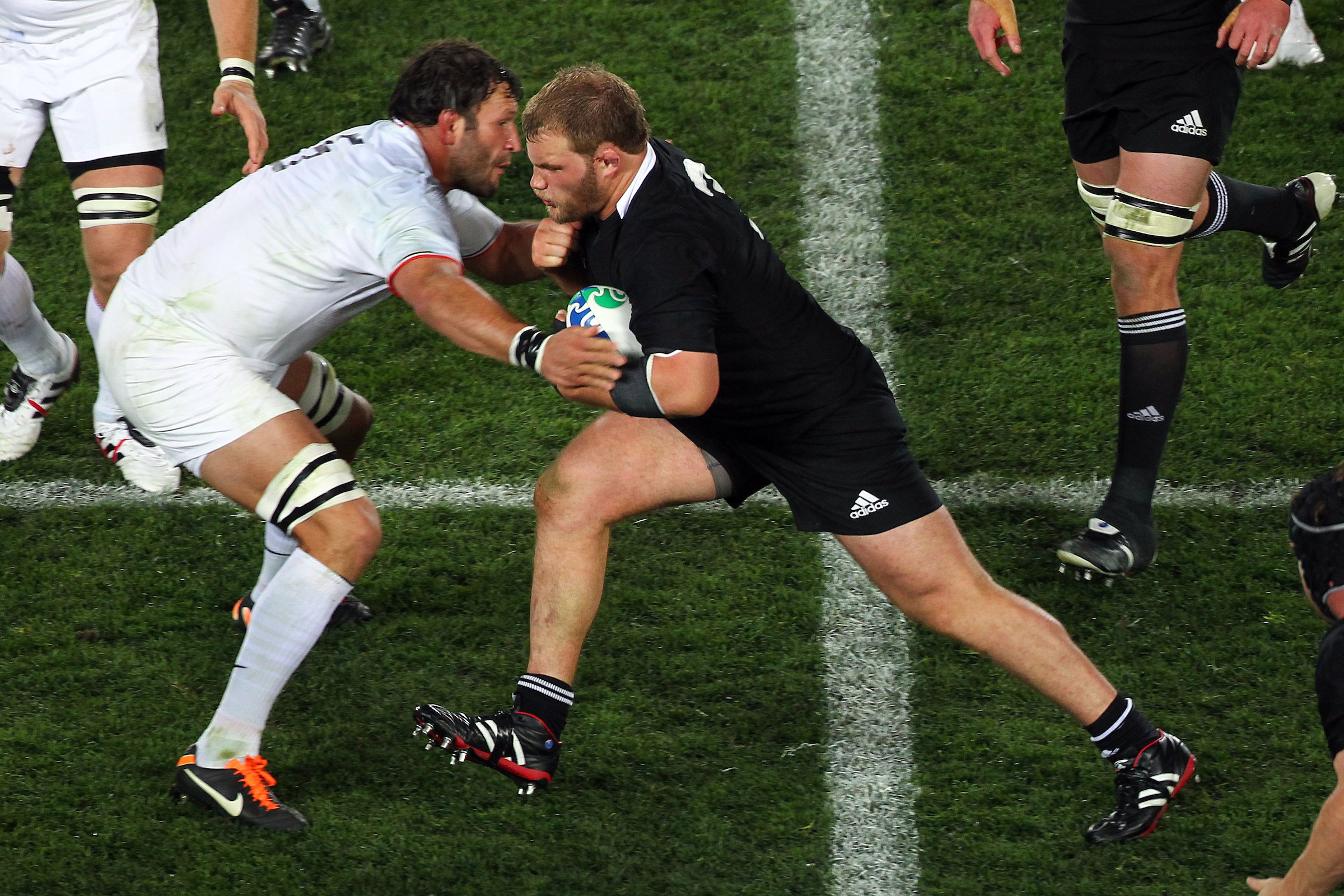 All Blacks' Owen Franks charges into France's Lionel Nallet during the All Blacks v France Final match of the 2011 IRB Rugby World Cup in October 2011. Photo / Photosport