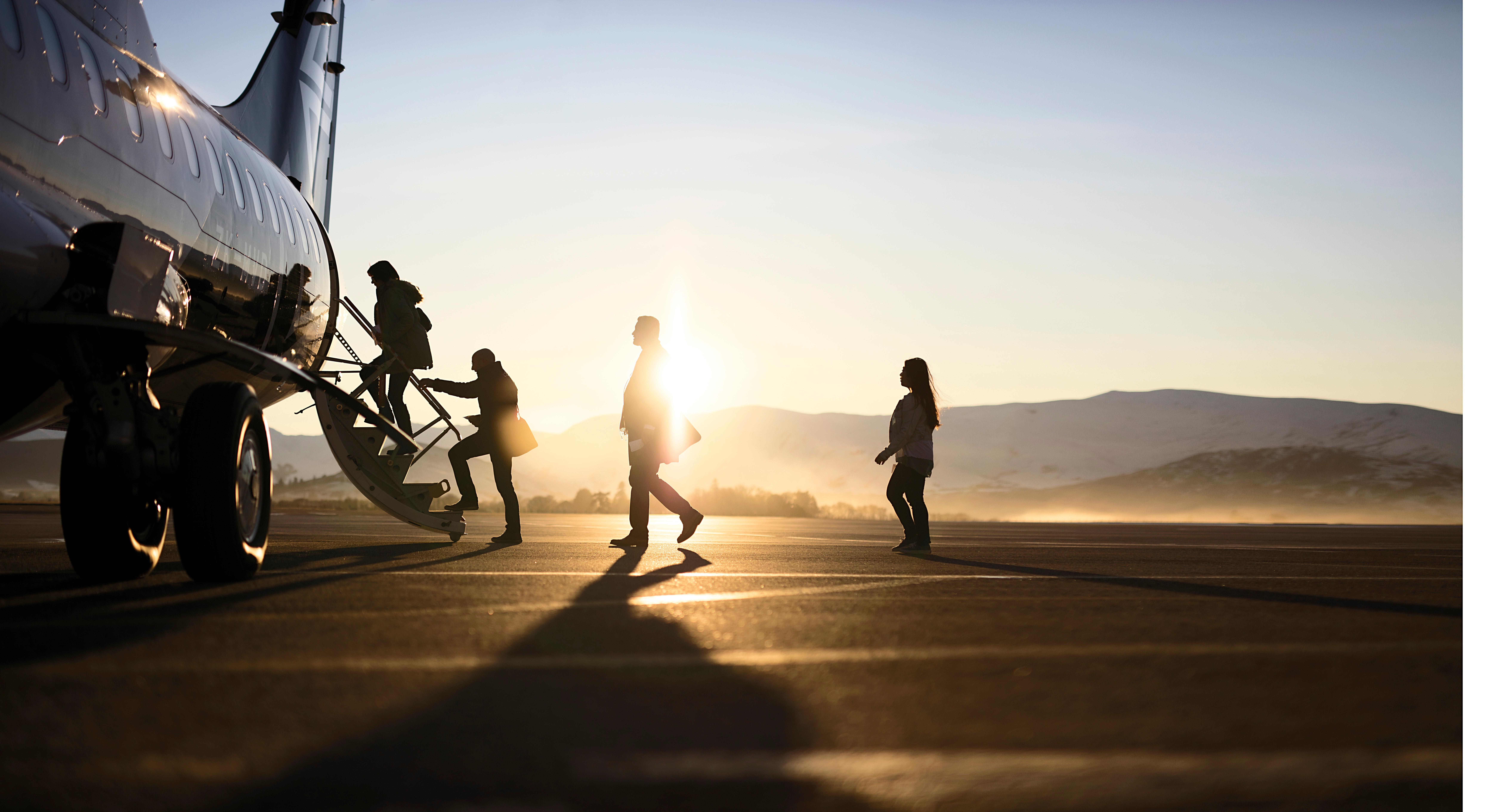 Sunshine days: Passengers board in Queenstown. Photo / AirNZ