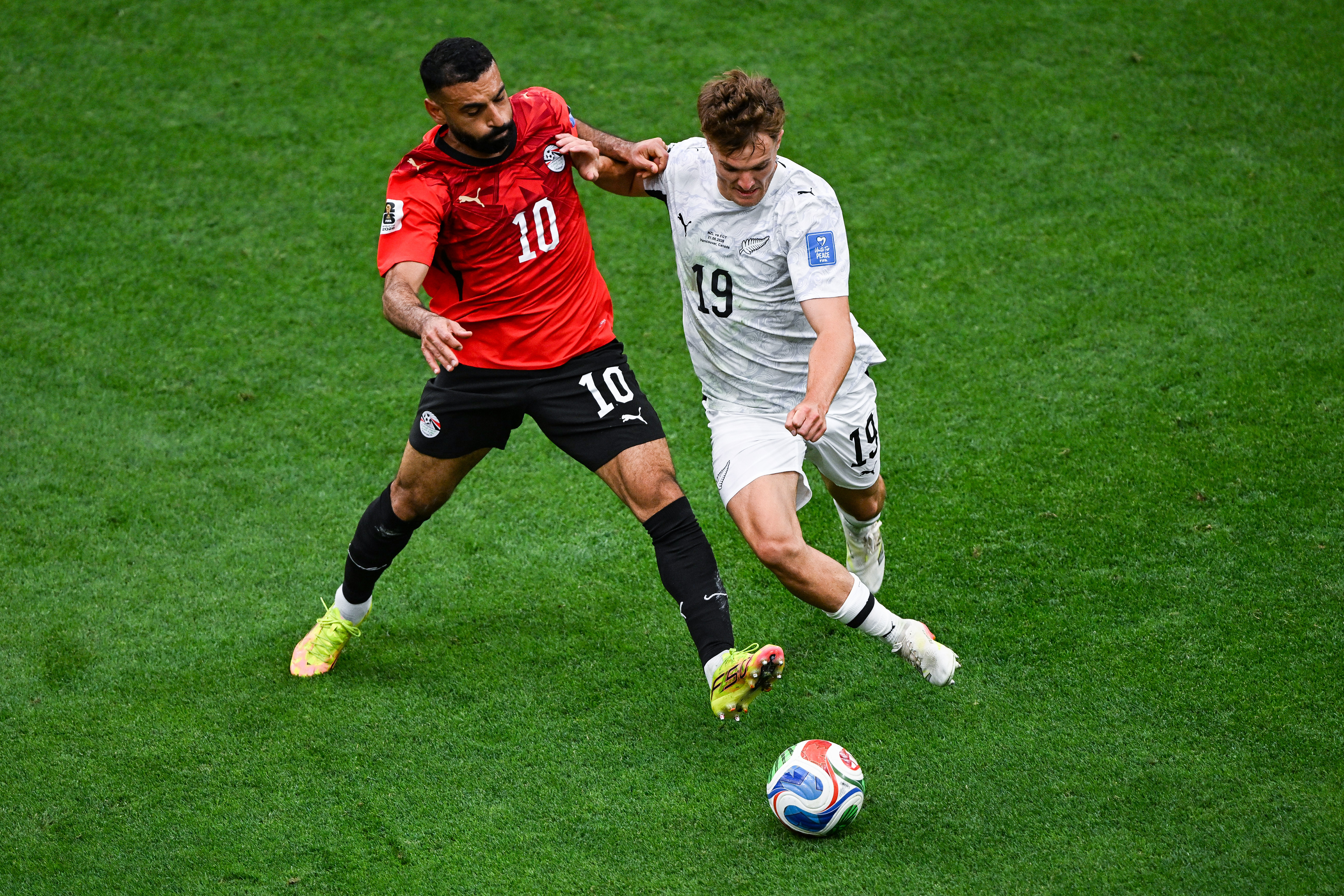Ben Old is challenged for possession by Egypt captain Mohamed Salah. Photo / Photosport