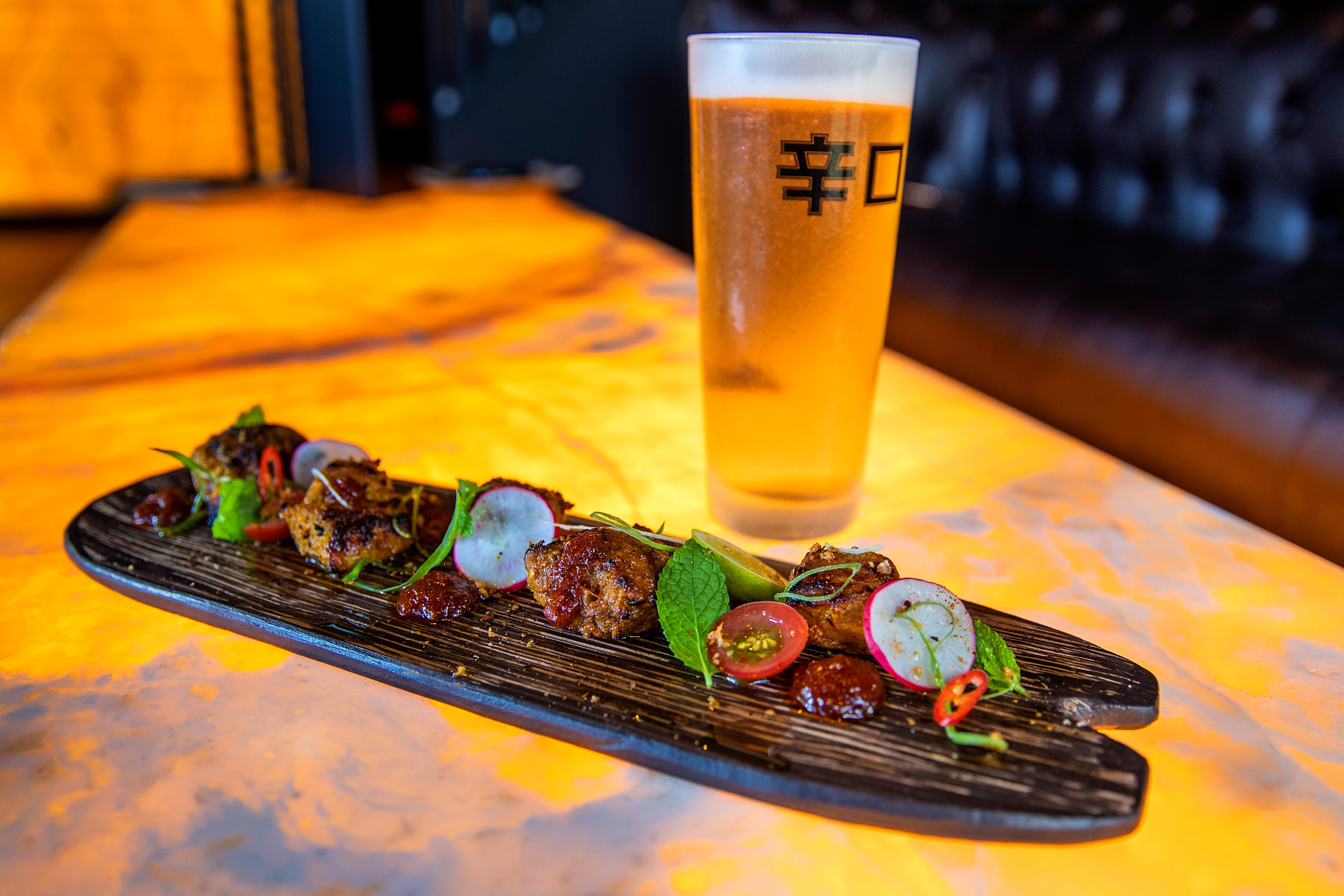 Lamb rump on a lit marble table at Scandal in Ponsonby. Photo / Getty Images