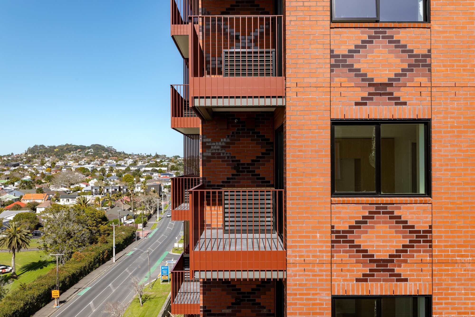  Ockham Residential and five-iwi collective Marutūāhu have developed the red Whetū apartment block at Pt Chevalier in Auckland. This is on former Unitec land. Photo / Ockham