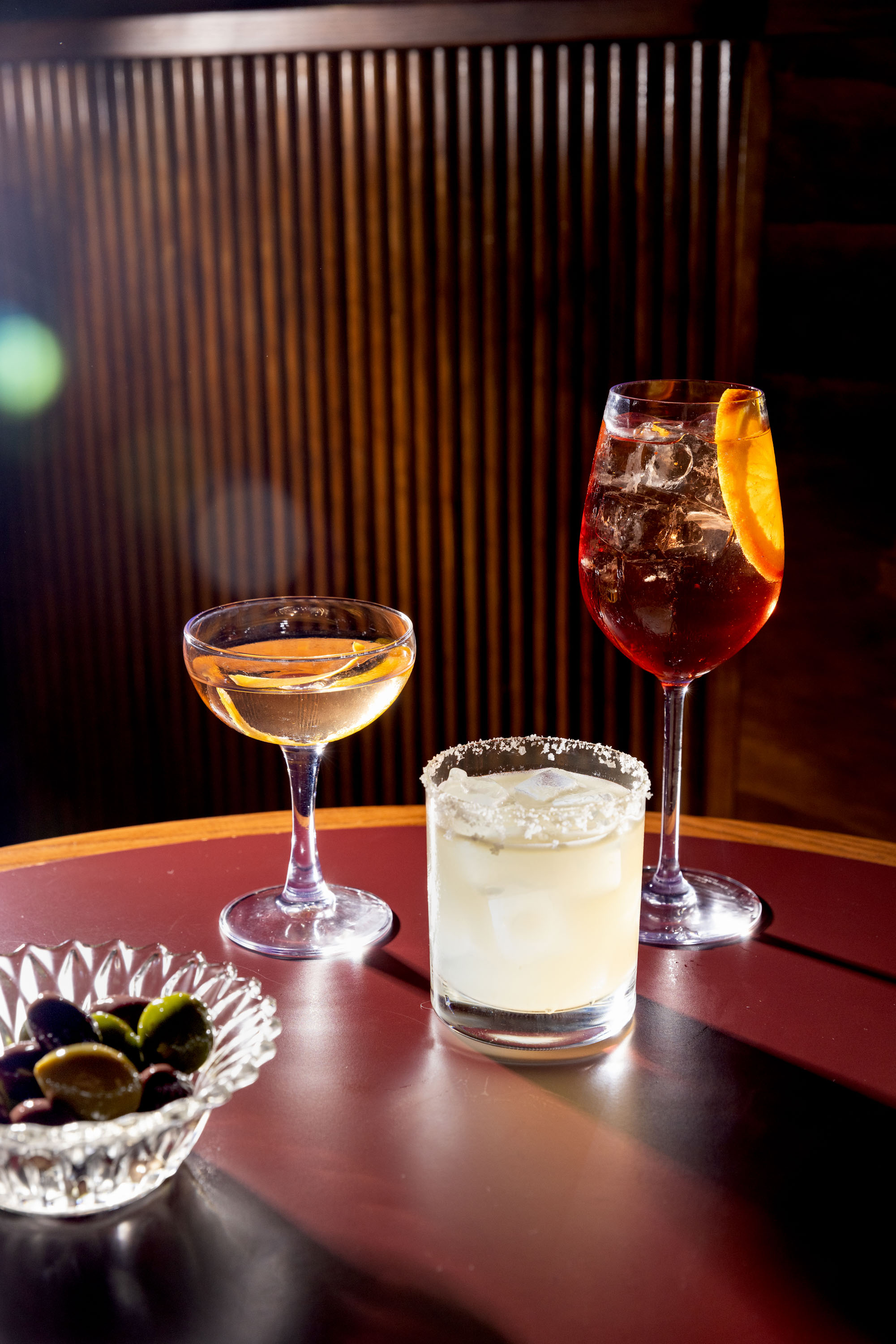 The Ram’s marigold martini, margarita and spritz cocktails, with a side of olives. Photo / Babiche Martens