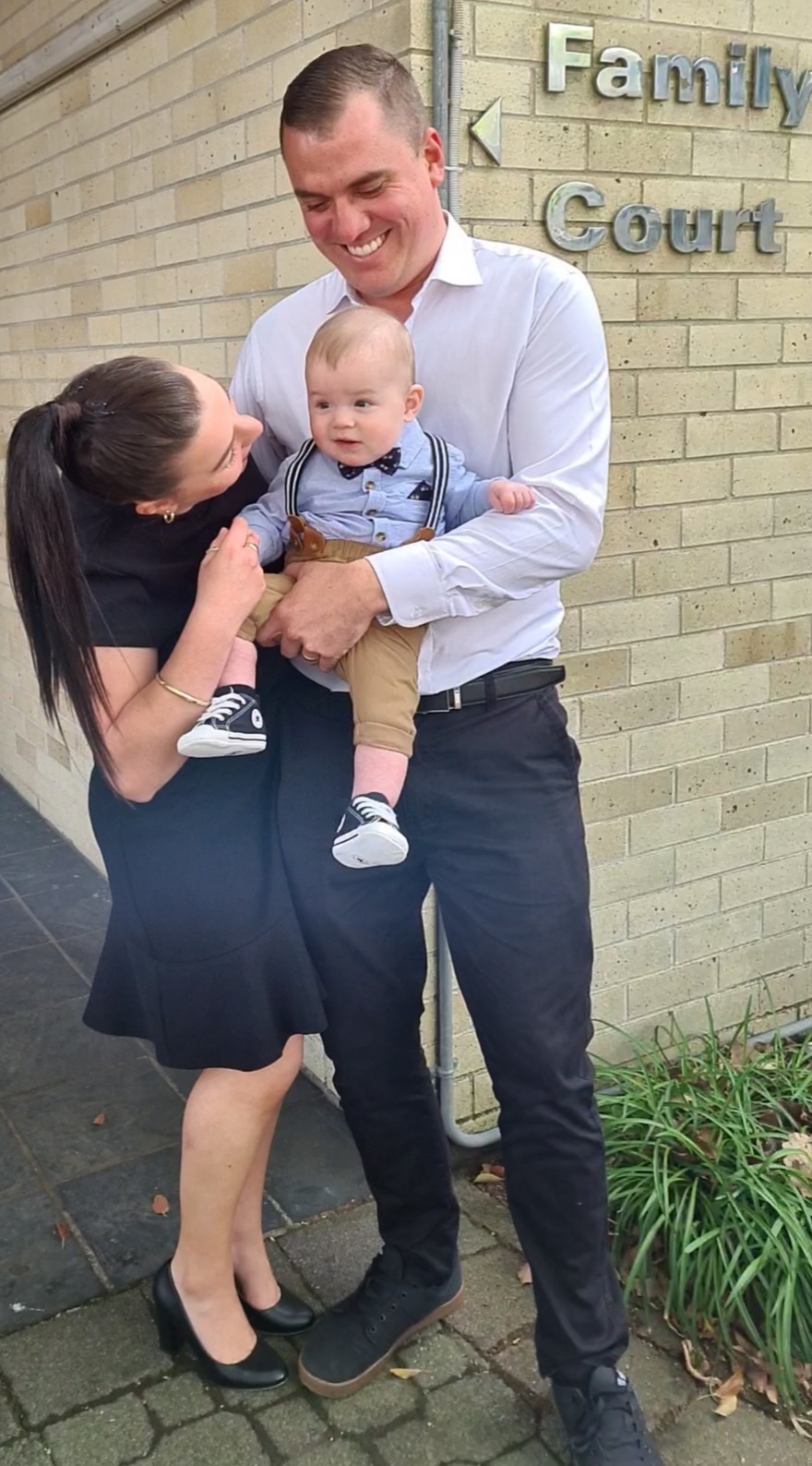 Stephanie and Matt Larnder with their son Grayson at the Family Court after officially adopting him.