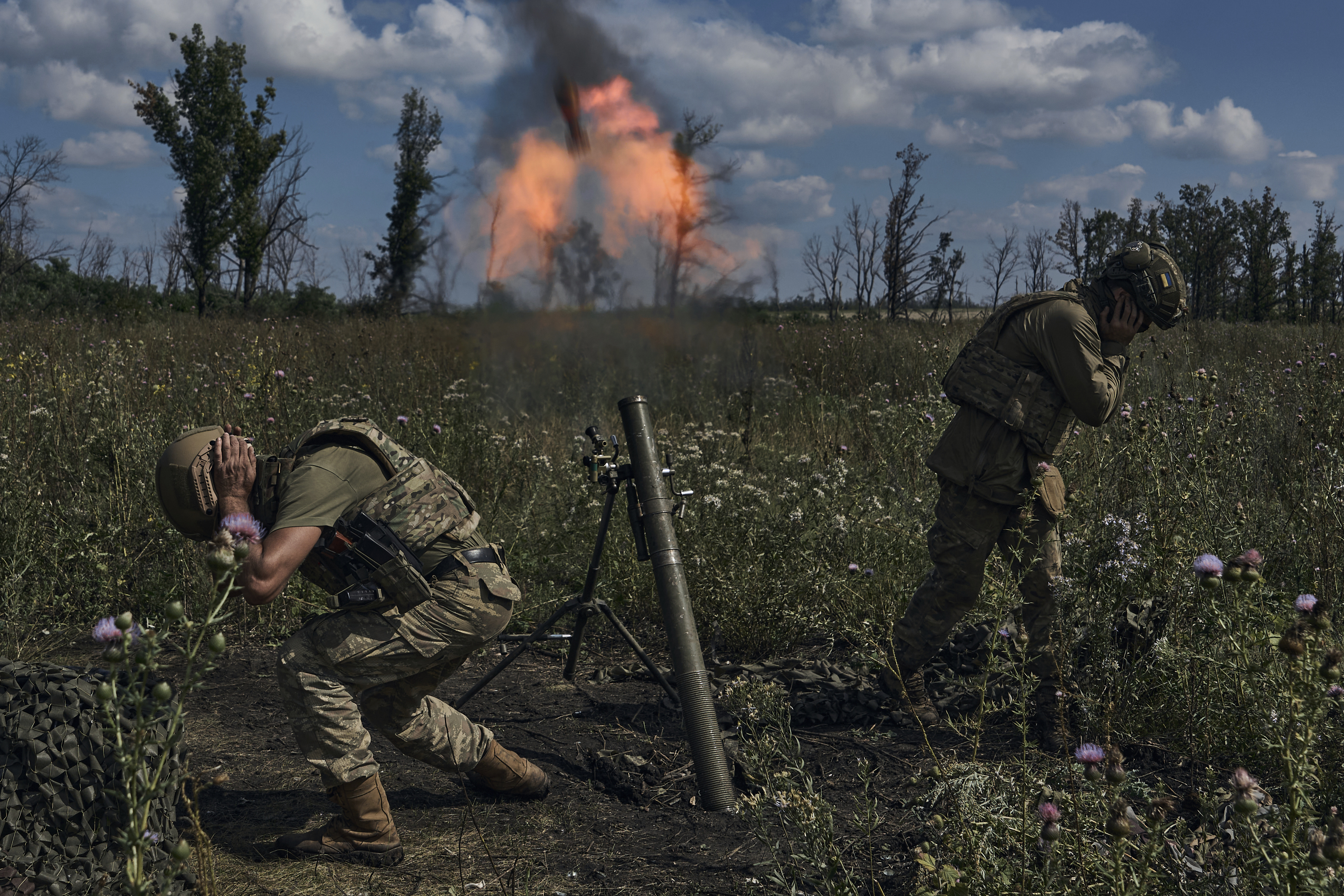 Ukrainian soldiers fire a mortar towards Russian positions at the front line near Bakhmut, in the Donetsk region Photo / AP