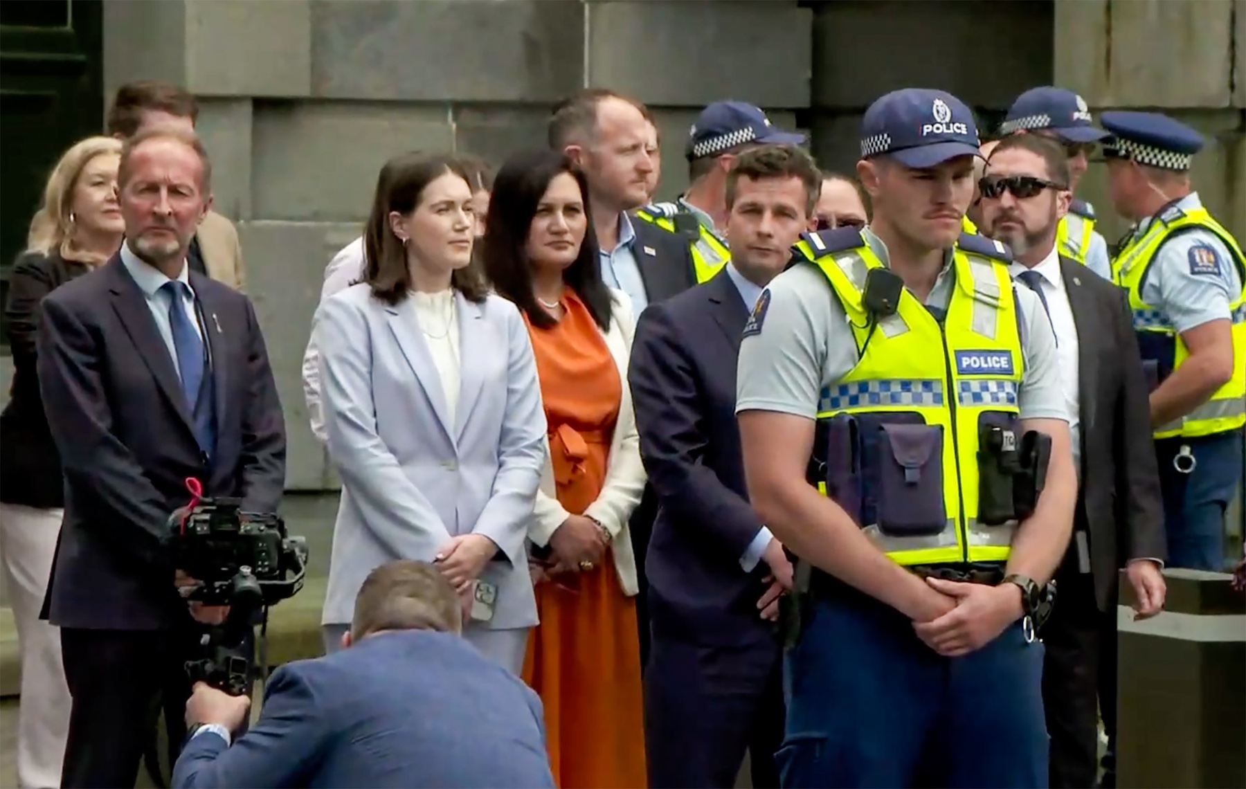 Act Party leader David Seymour and the Act caucus stand on the steps at Parliament to watch the Hīkoi mō te Tiriti in Wellington on Tuesday. Image / NZME 