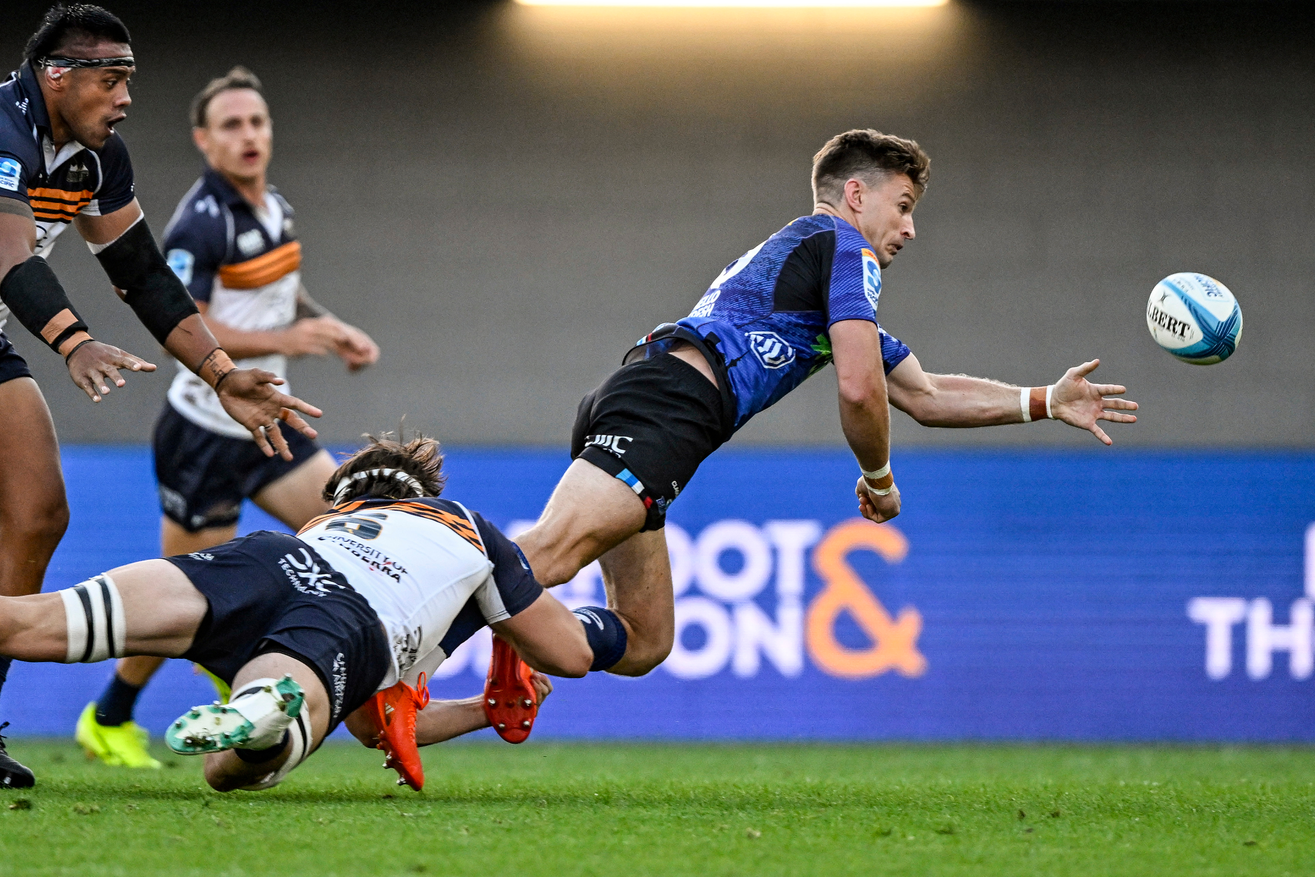 Beauden Barrett gets a pass away against the Brumbies. Photo / Photosport