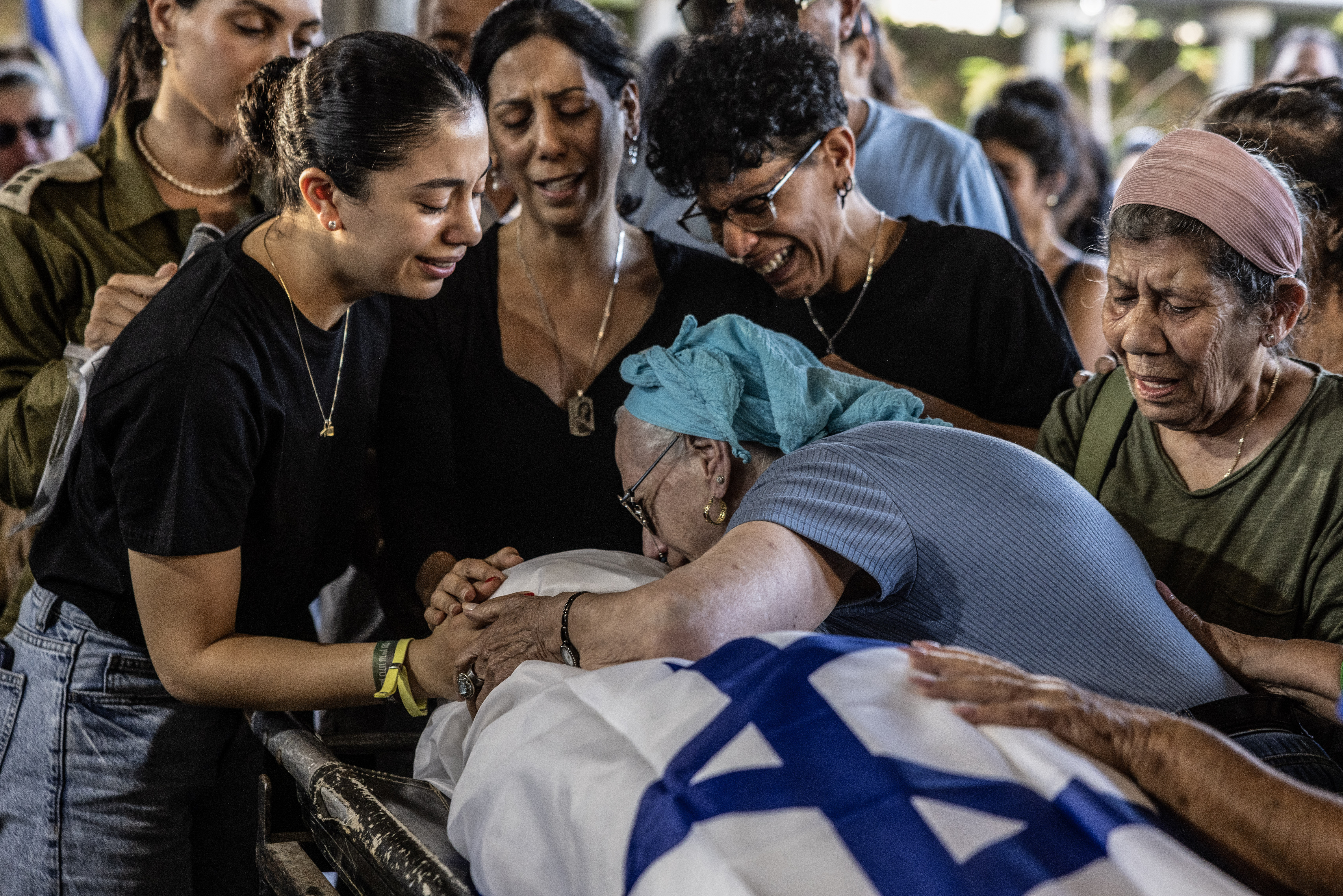 Family members mourn over the body of Israeli hostage Eden Yerushalmi during her funeral in Petah Tikva, Israel. She was one of the six captives found dead by Israeli forces last weekend. Photo / Heidi Levine for the Washington Post