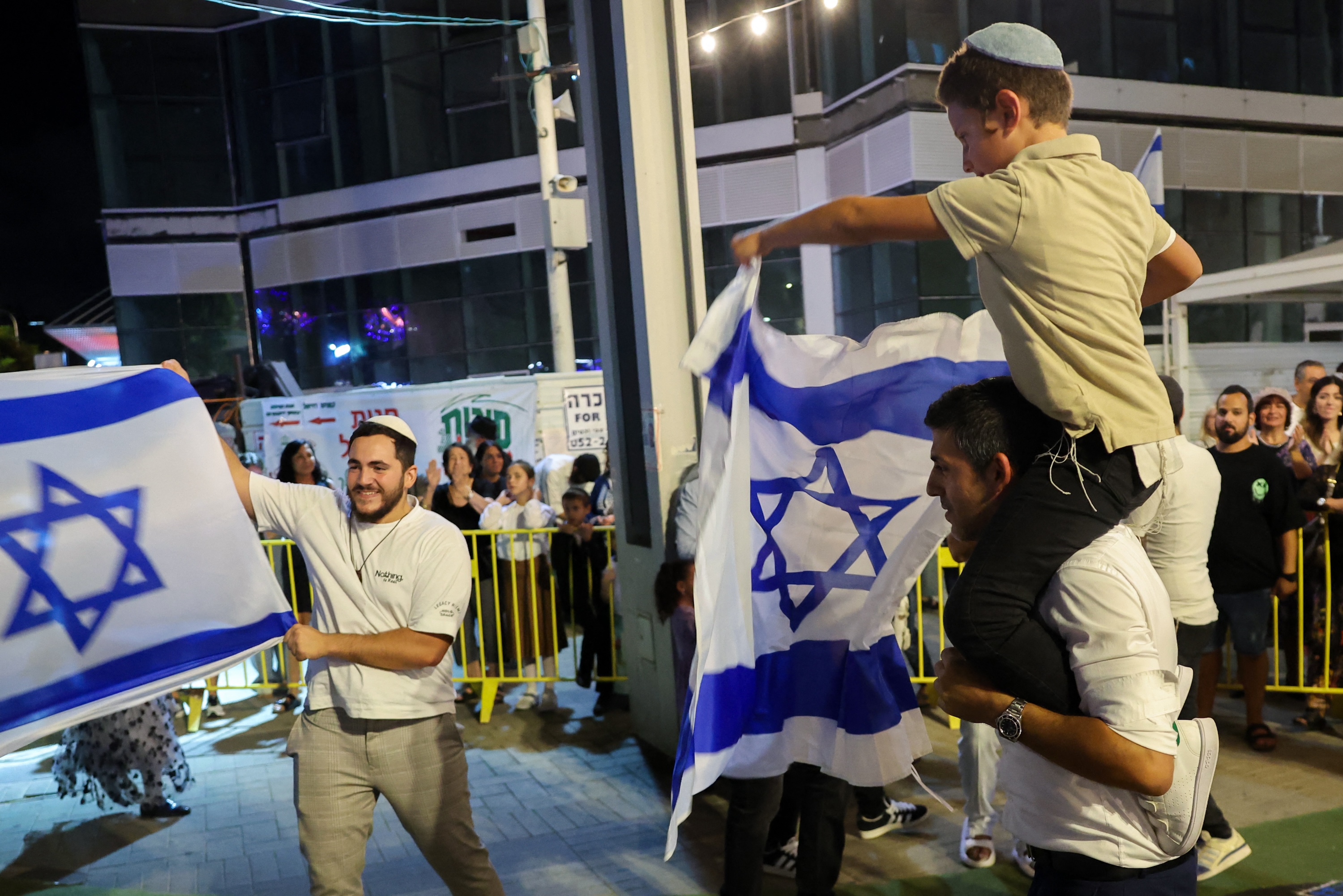 Israelis in the coastal city of Netanya celebrate news of the assassination of Hamas leader Yahya Sinwar. Photo / AFP