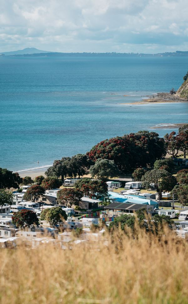 Martins Bay Holiday park is an hour from Auckland CBD with safe swimming, a boat ramp, kayaks and SUP boards to rent.
Photo / Supplied