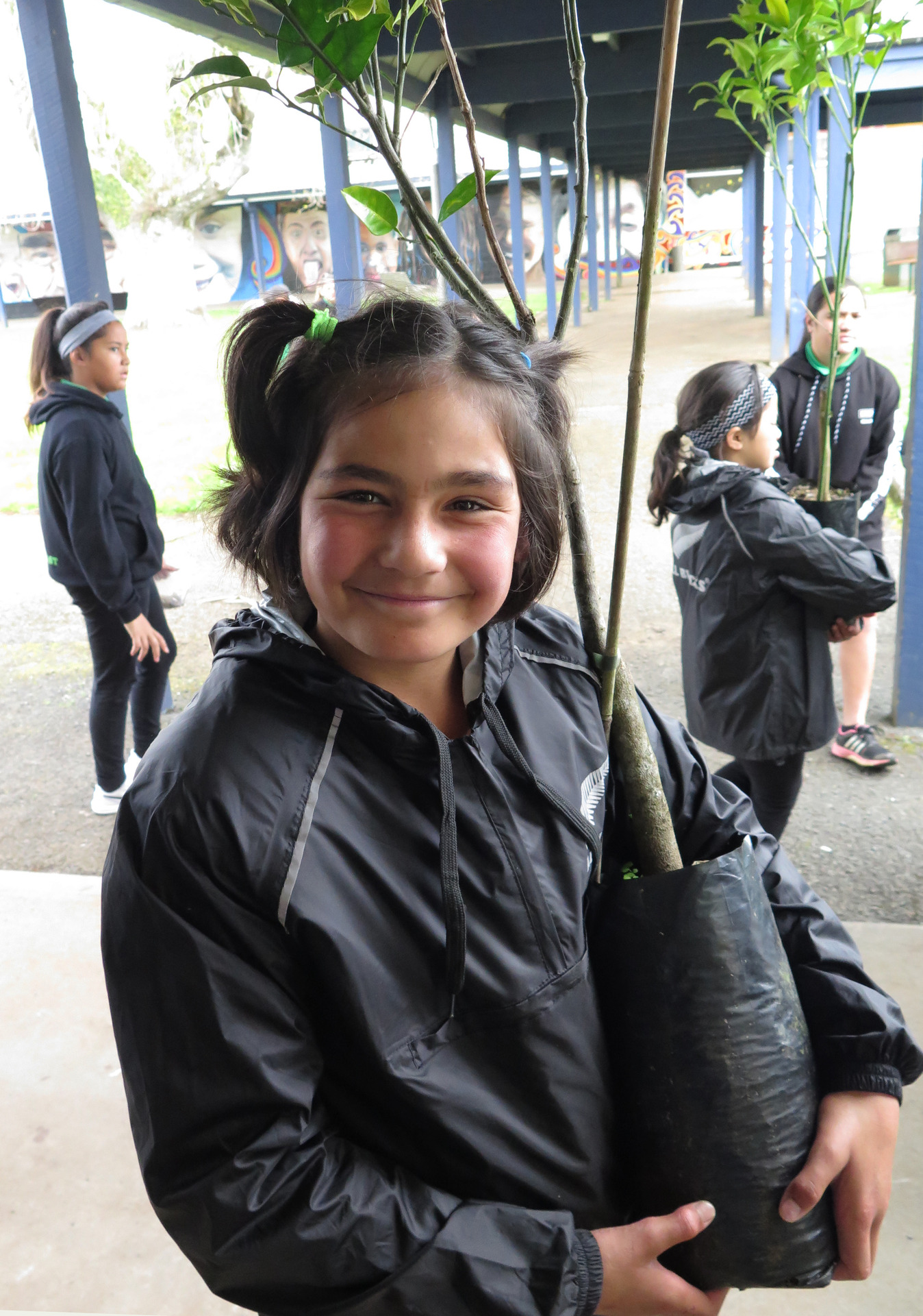 After the pātaka kai opening Kaikohe East students, including Jayden Tango, 10, were given citrus trees to plant at school. Photo / Peter de Graaf