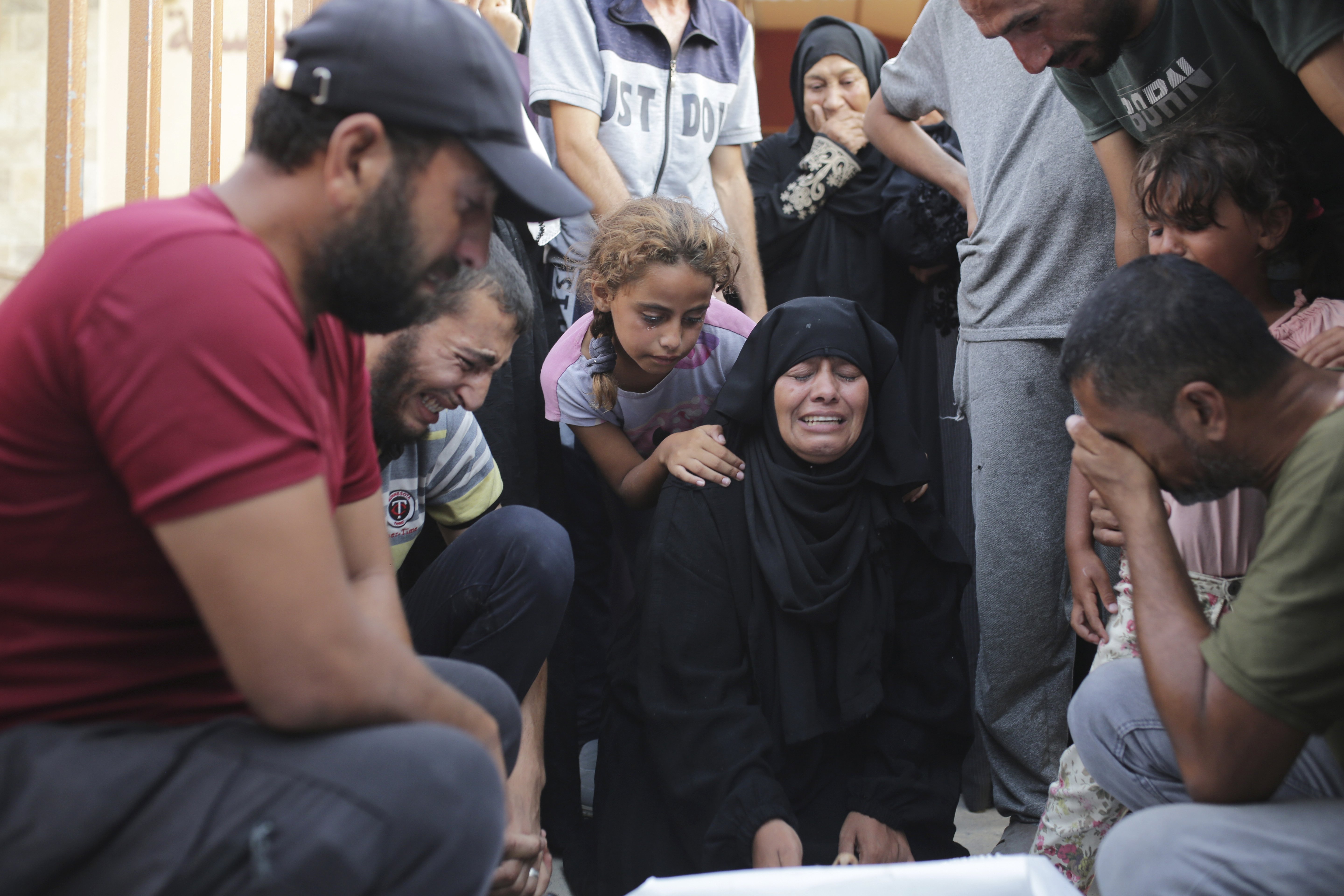 A Palestinian family mourns a loved one killed by Israeli bombardment, as they take a last look before their funeral in Khan Younis, southern Gaza Strip. Photo / AP