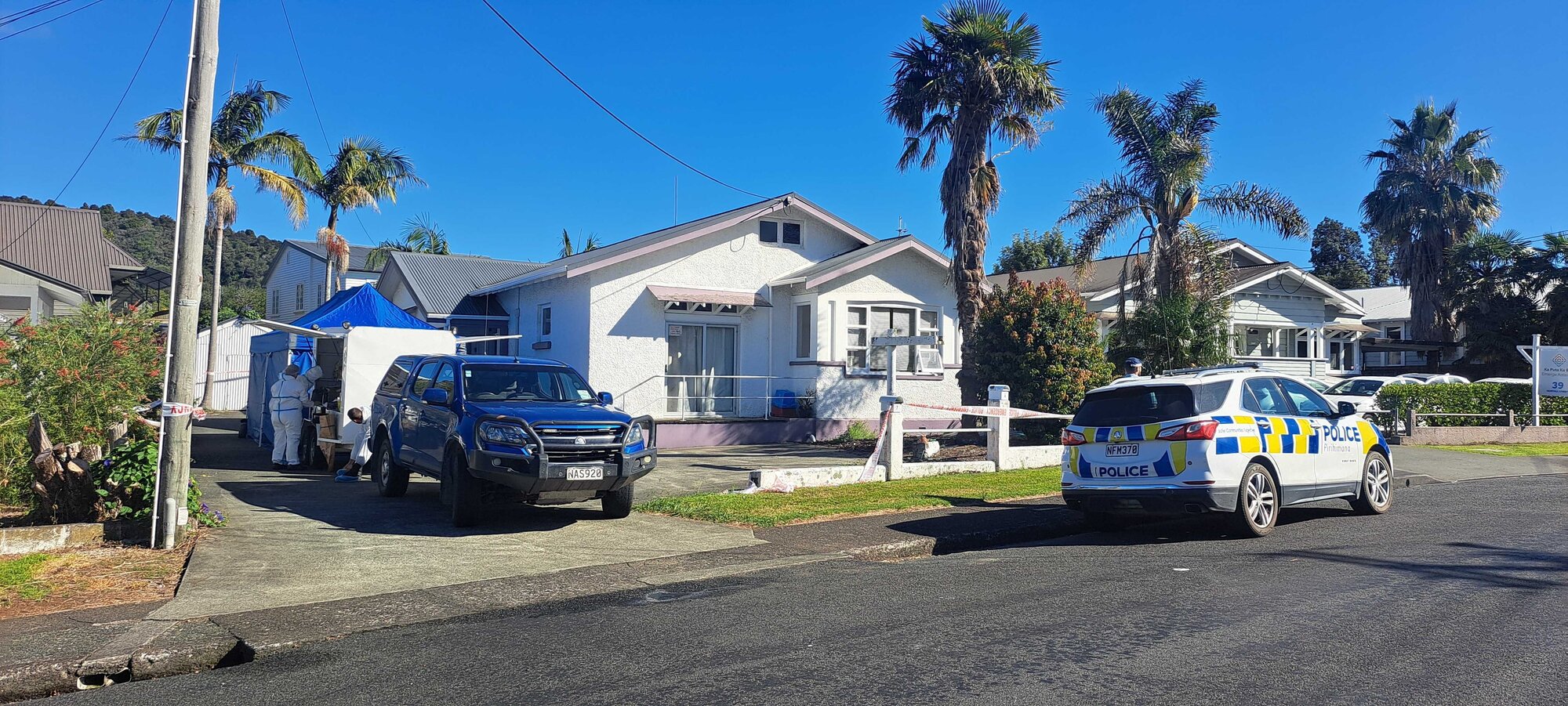 Police at the scene of a homicide in Whangārei on Norfolk Street. Photo / Brodie Stone