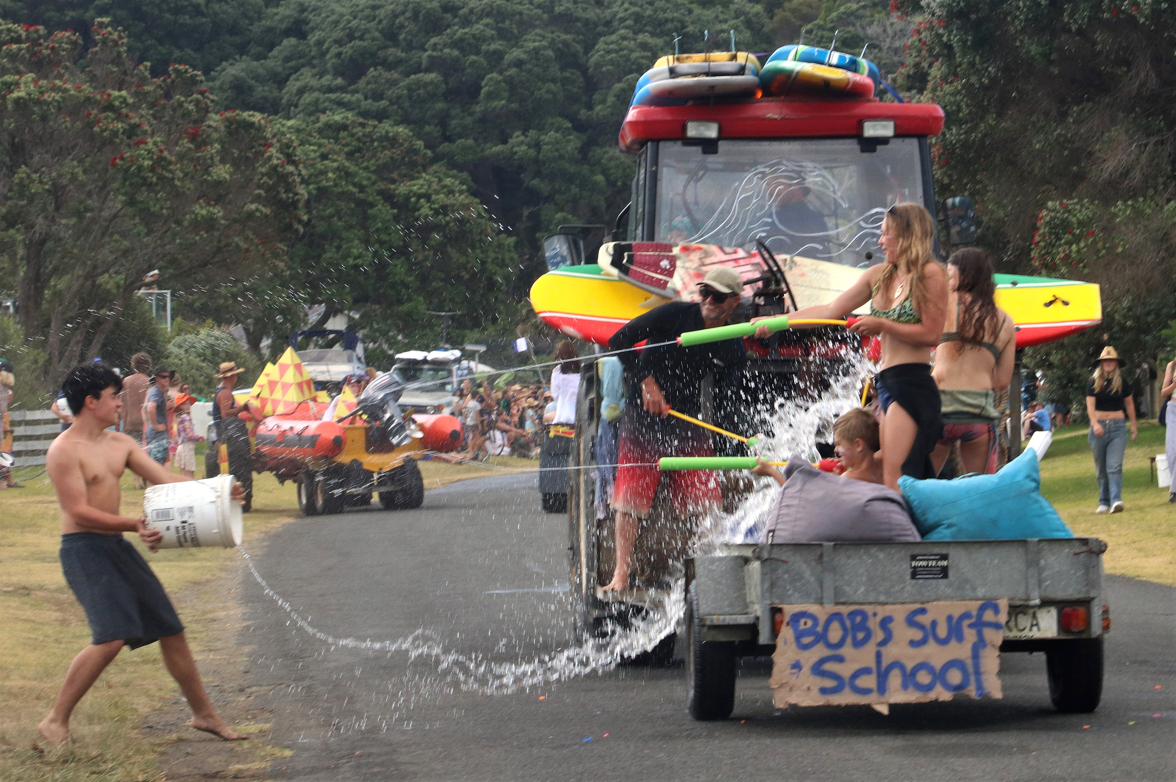 The crew of Bob’s Surf School came prepared for a water fight. Photo / Peter de Graaf
