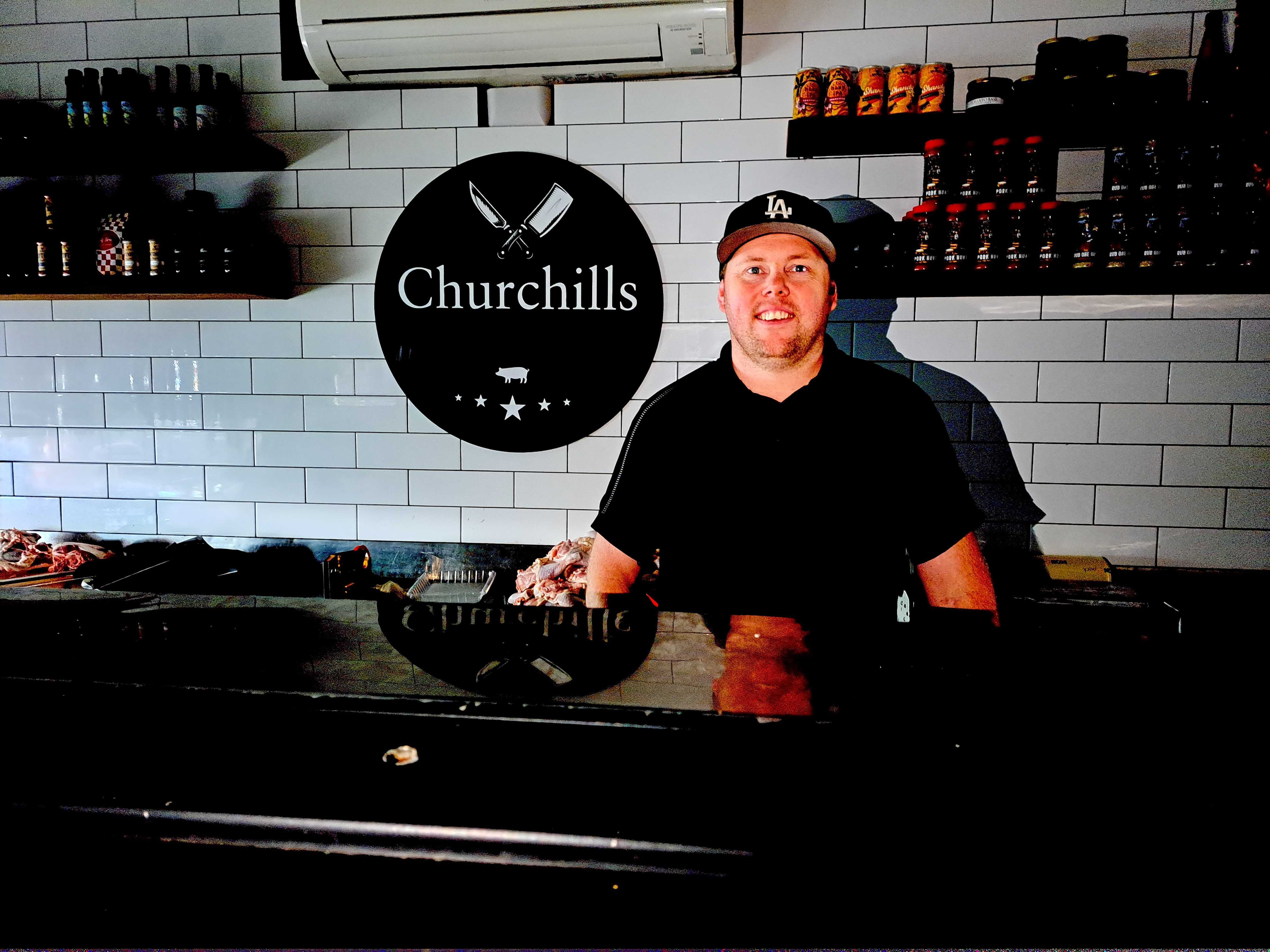 Jarred Meehan from Churchill Butchers and his team were serving customers in the dark with moble eftpos. Photo / Jenny Ling