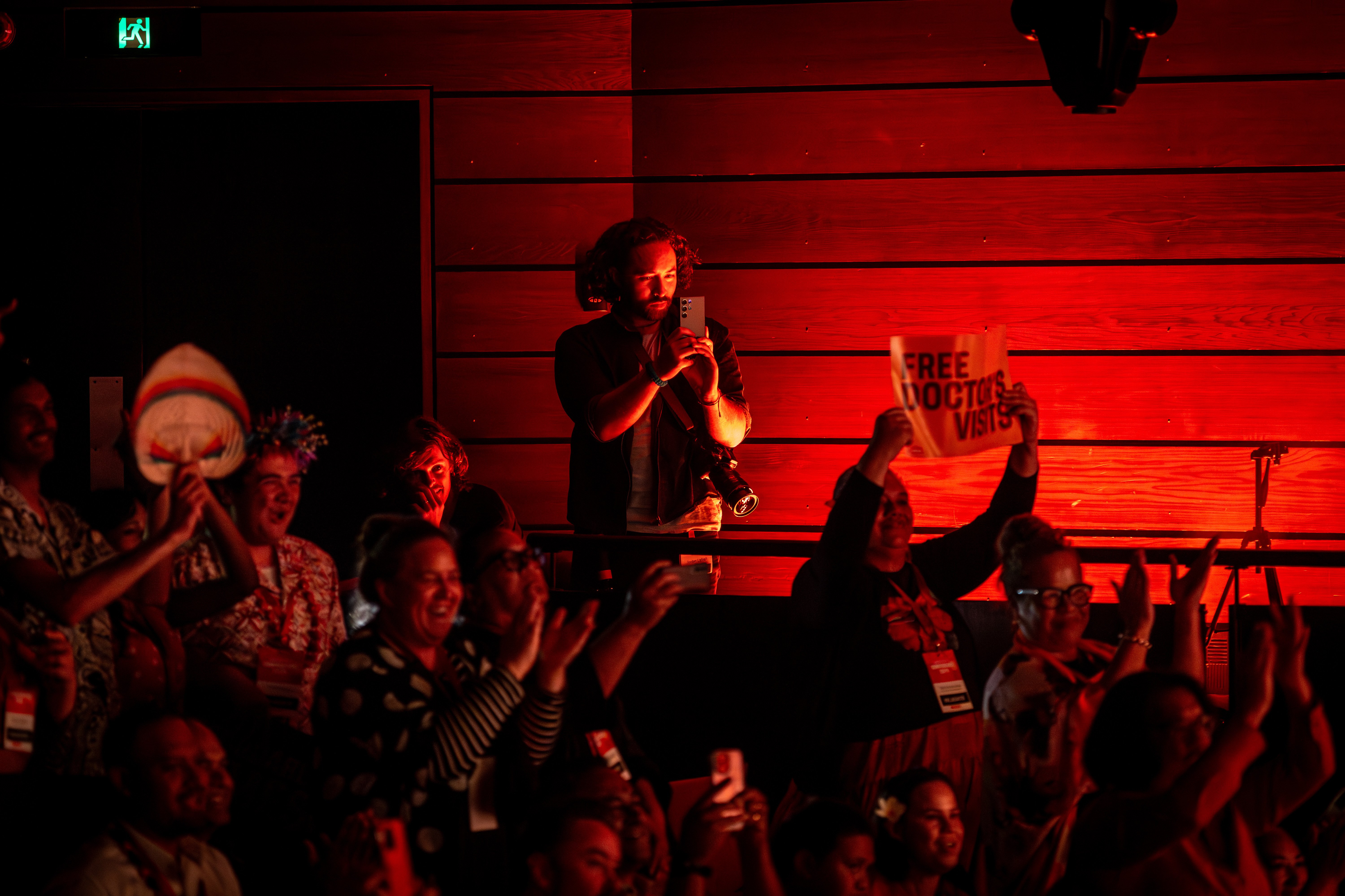 Jordan Rivers (centre holding phone), pictured here at the Labour Party conference, works as a social media adviser in the office of the Labour leader. Photo / Michael Craig