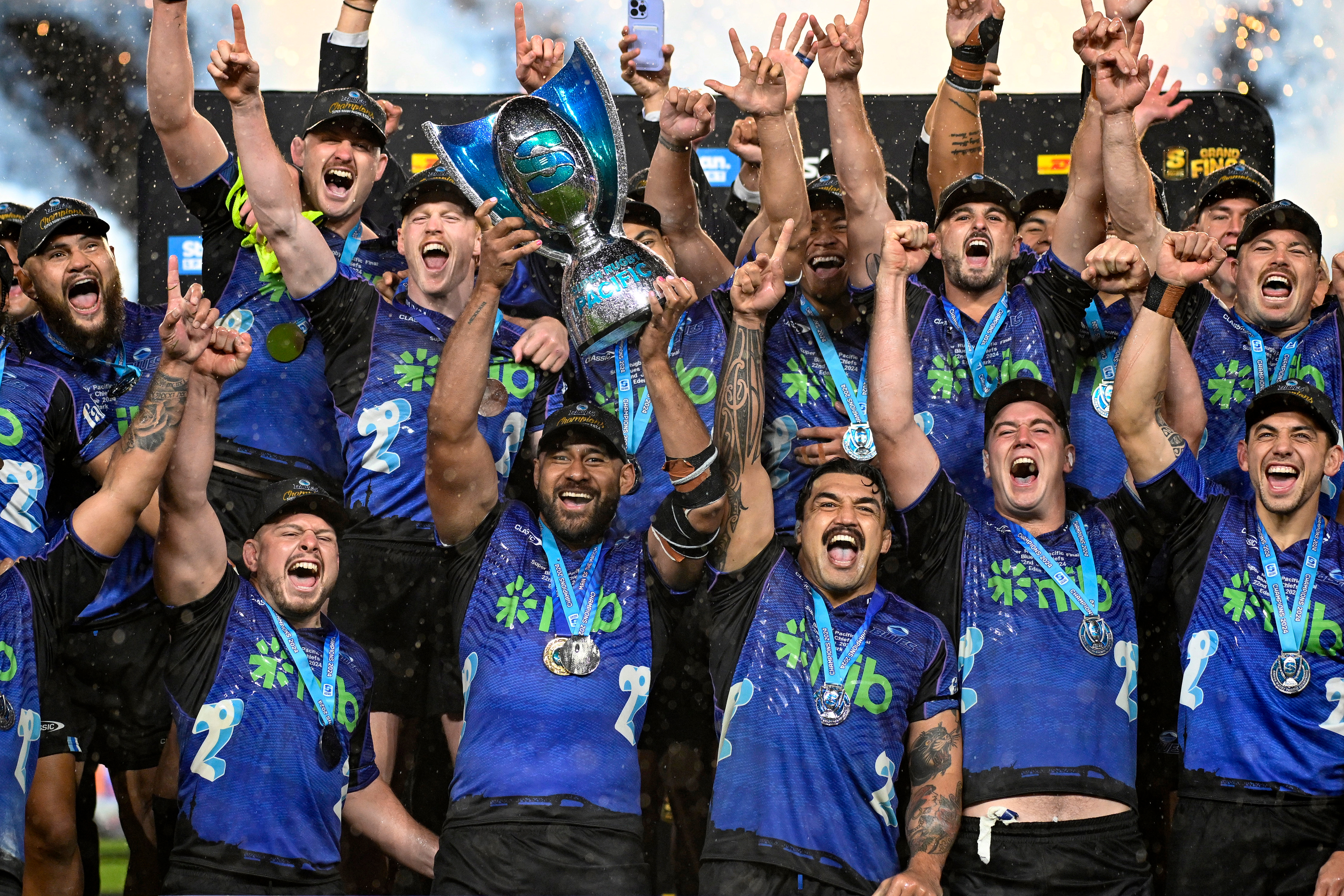 Patrick Tuipulotu lifts the Super Rugby Pacific trophy. Photo / Photosport