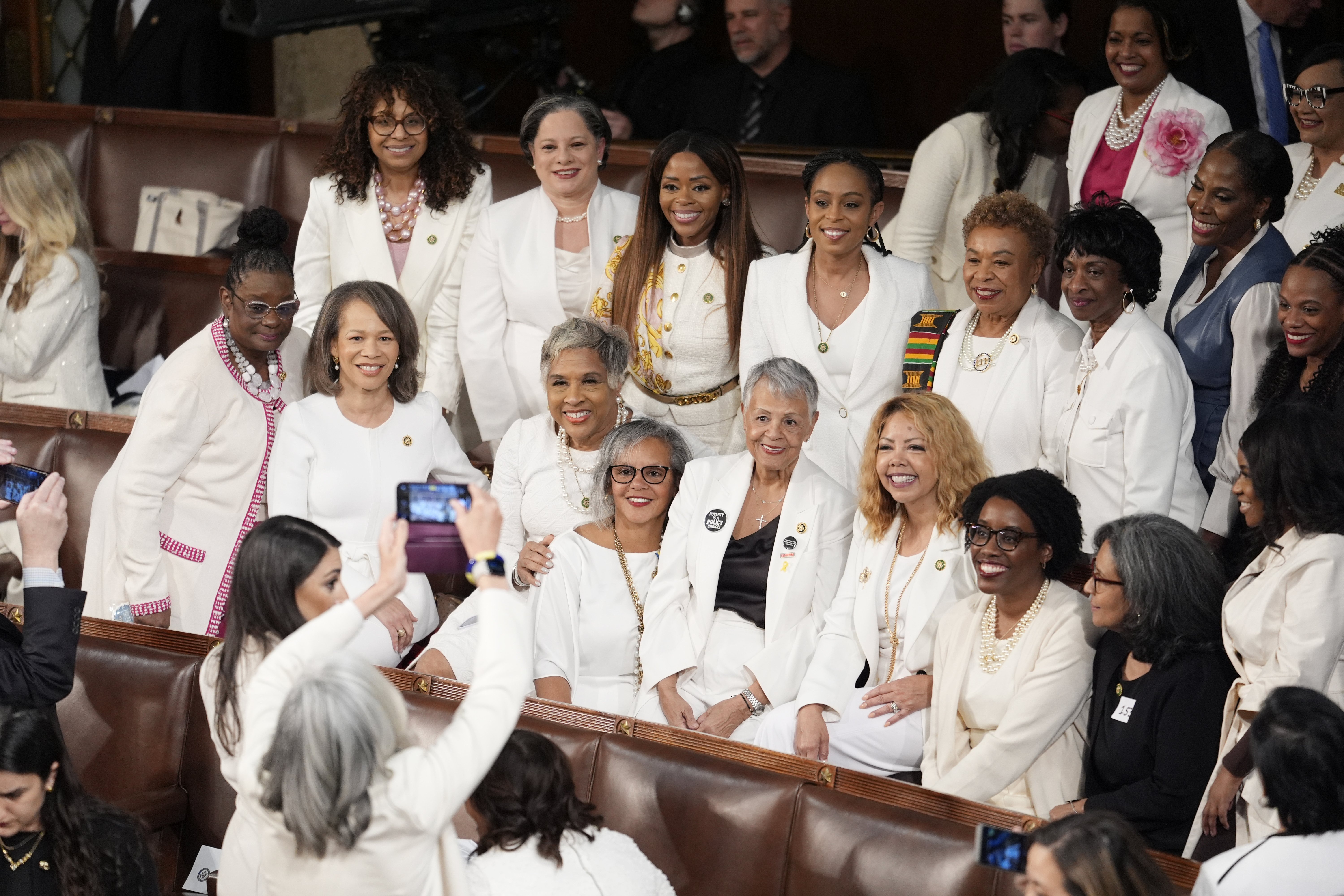 Women members of the House of Representatives pose for photos before President Joe Biden arrives to deliver his State of the Union address. Photo / AP