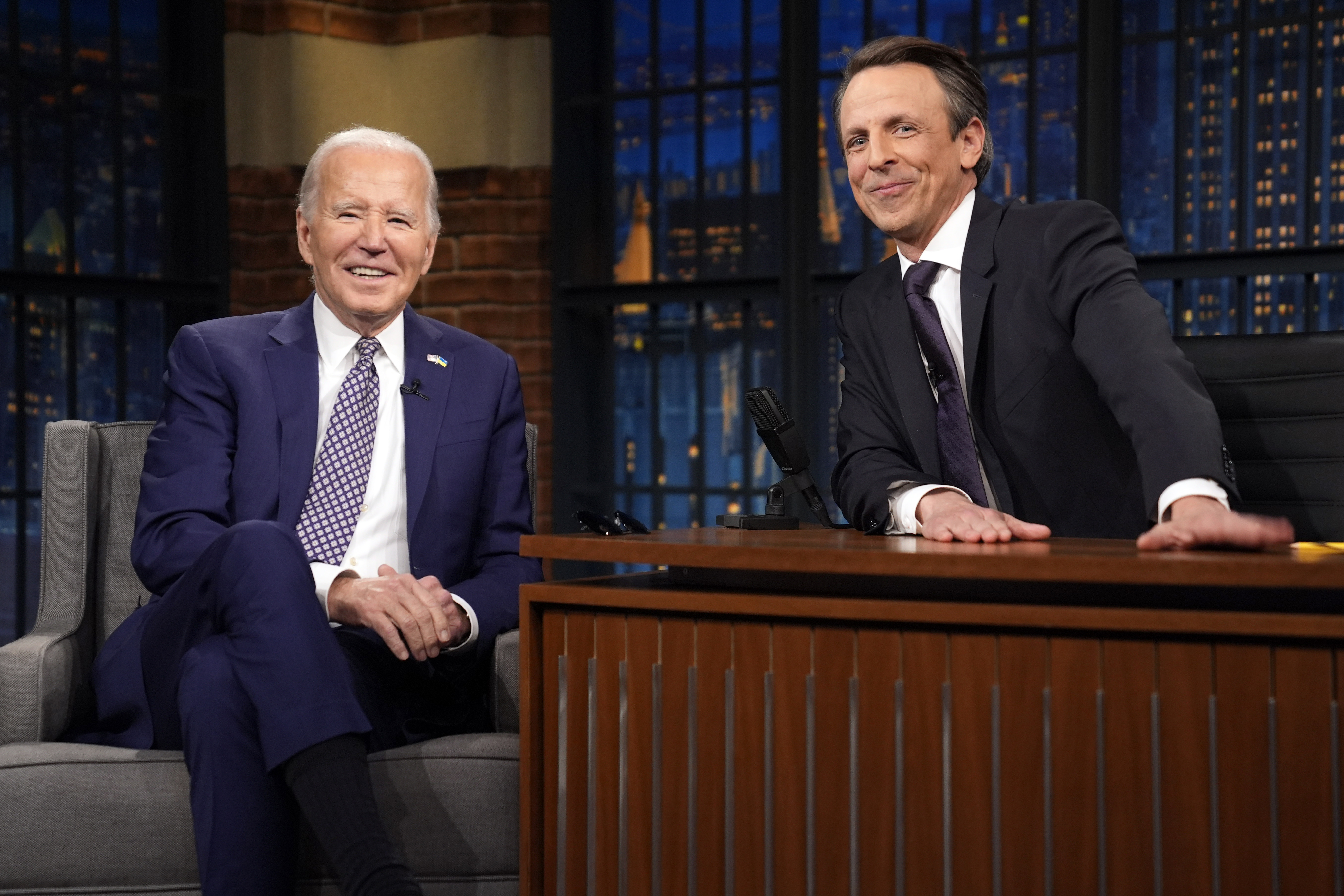President Joe Biden talks with Seth Meyers during a taping of the Late Night with Seth Meyers. Photo / AP