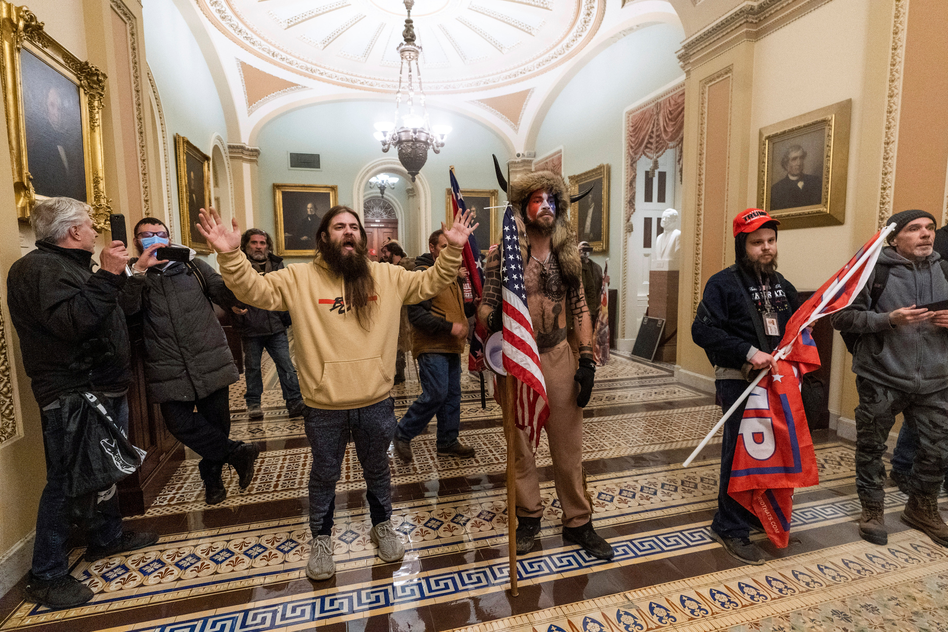 Supporters of President Donald Trump are confronted by US Capitol Police officers outside the Senate Chamber inside the Capitol in Washington. Photo / AP