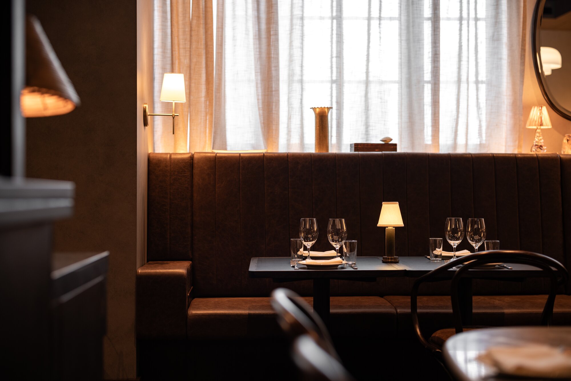Enjoy dinner by lamplight at Bistro Saine. Photo / Babiche Martens