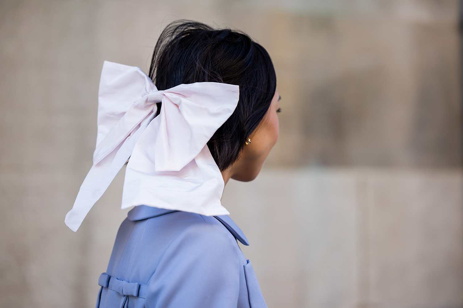 A guest wears a bow tie outside the Sandy Liang show during New York Fashion Week. Photo / Getty Images