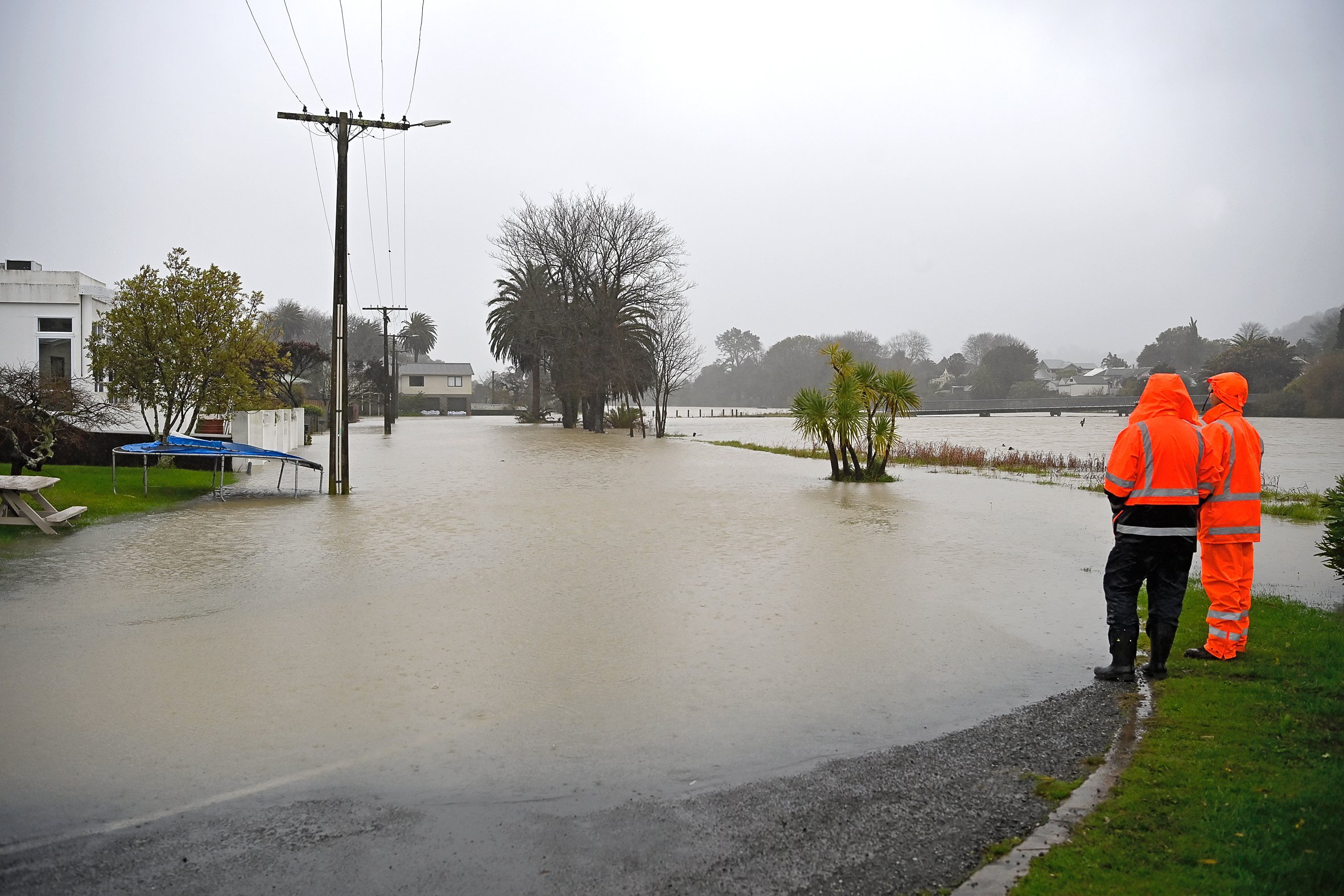 Flooding on Thompson St, alongside the Taruheru River, in central Gisborne. Photo / Paul Rickard
