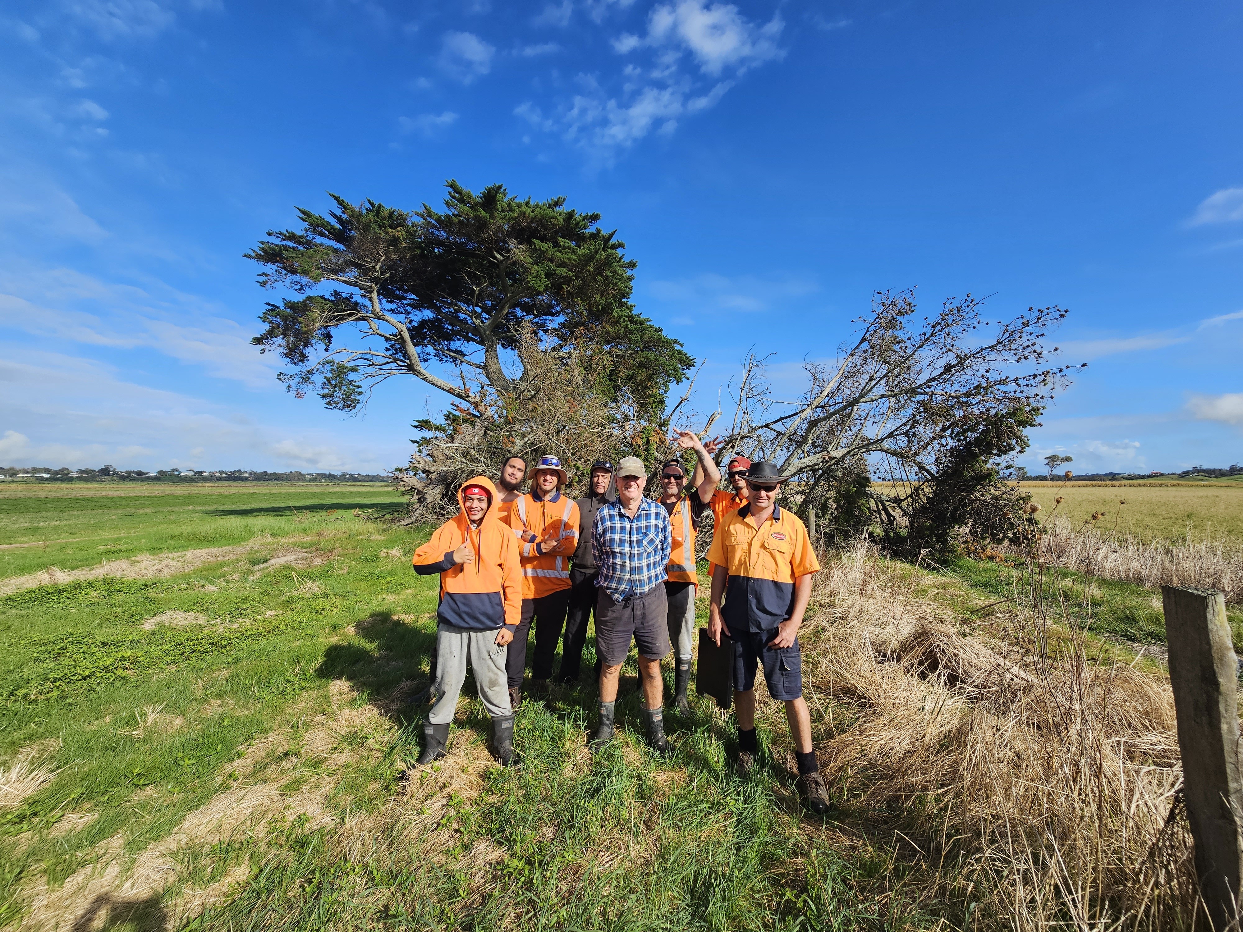 The pending Ngā Manga Atawhai crew on Turiwiri Kaipara farmer Kerry Perrea’s property. Pictured from left: Devante Tane-Hohaia, Haze Joseph Brown, Shannon Korau (supervisor), Ernest Manuel, farmer Kerry Perreau, Verran Hita, Santana Te Rore and Lance Dean (supervisor). Photo / Te Roroa