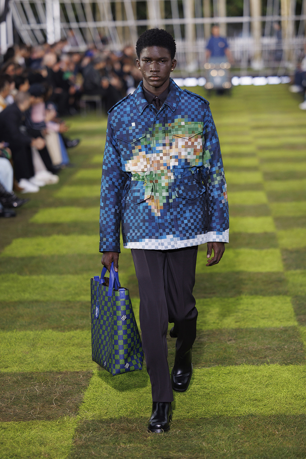 Pixelated world map detailing at Louis Vuitton. Photo / AP