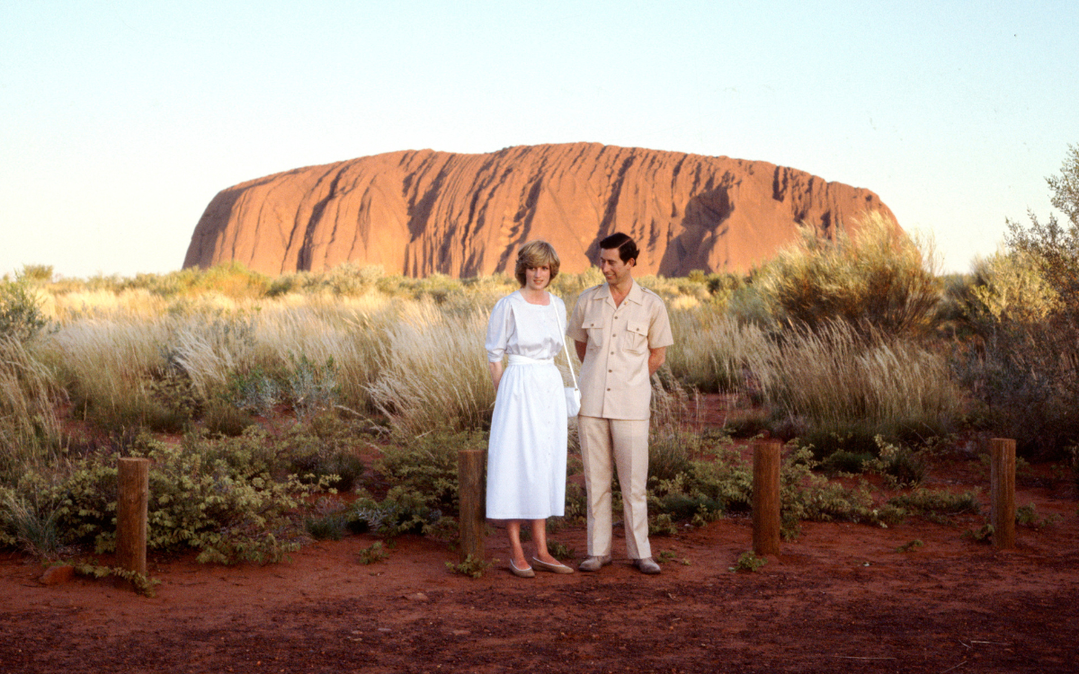 Then-Prince Charles and Princess Diana stand in front of Uluru during their 1983 tour of Australia. Photo / Getty Images