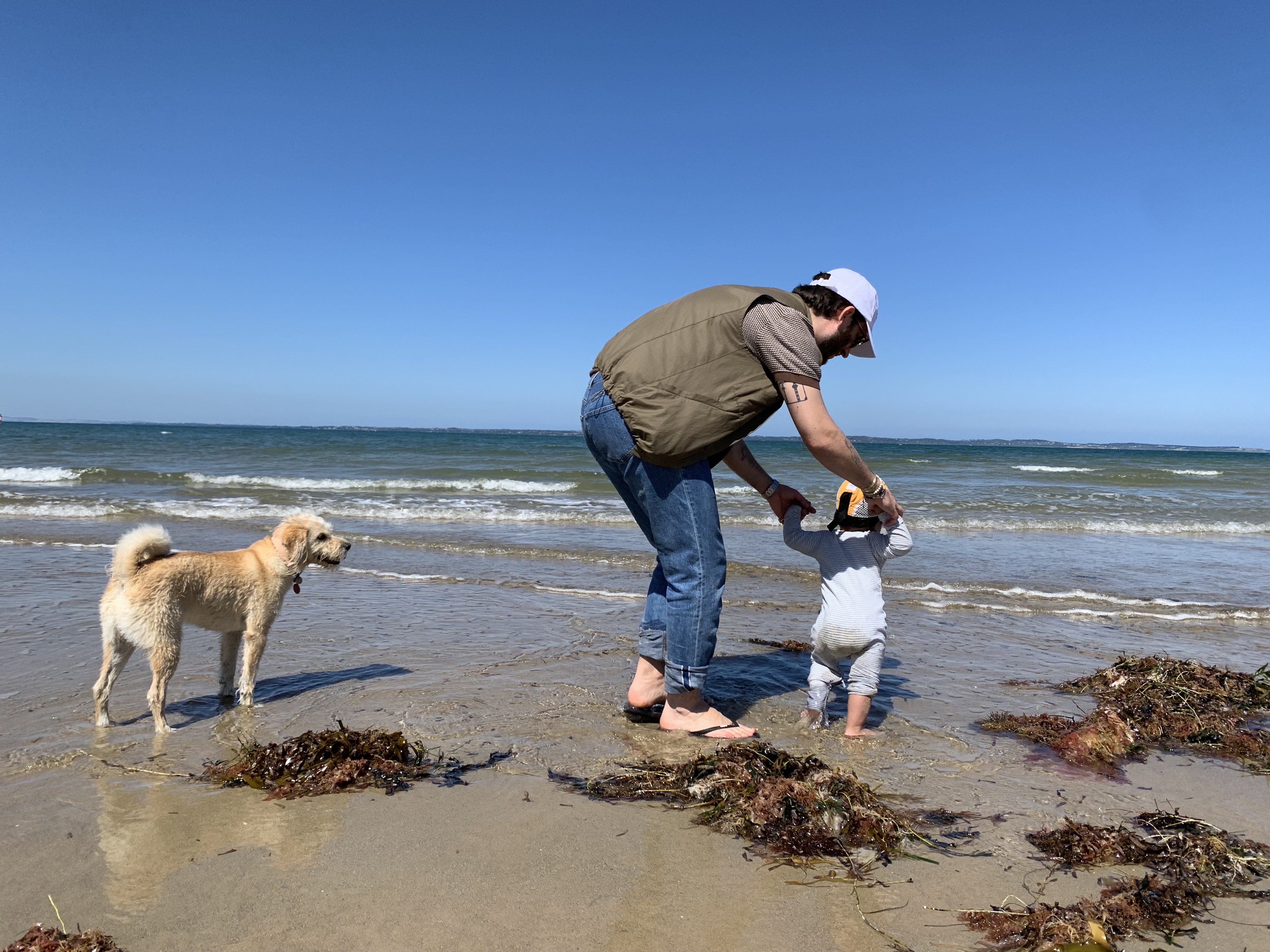 Christian Kimber and his son at the beach. Photo / Supplied