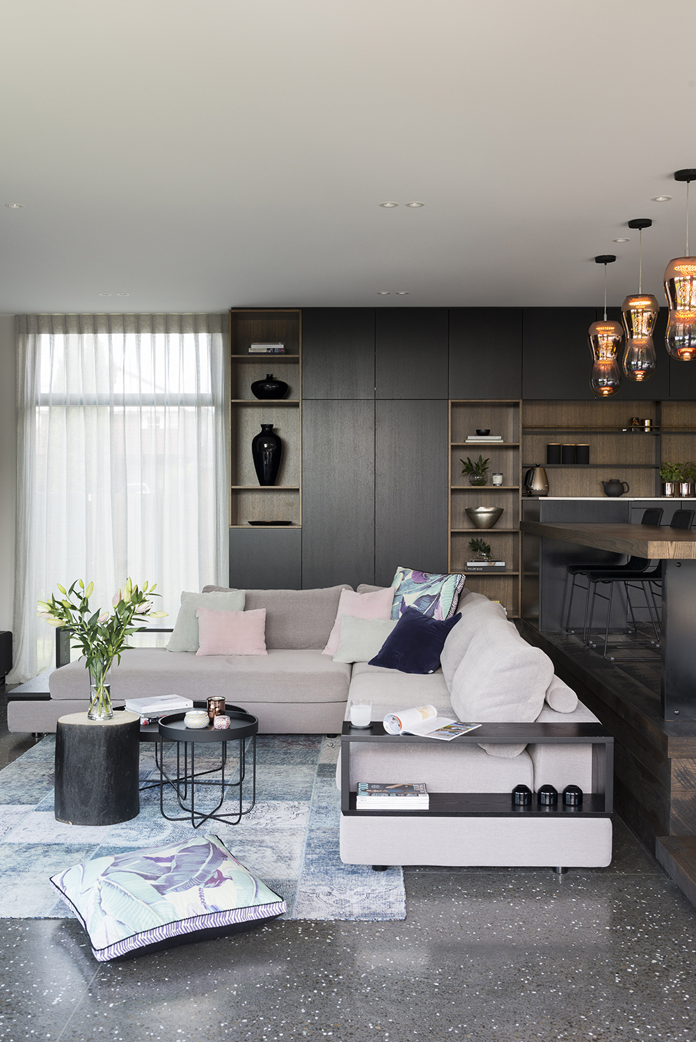 Invest in a rug to pull your living room together. Photo / Cave Bureau