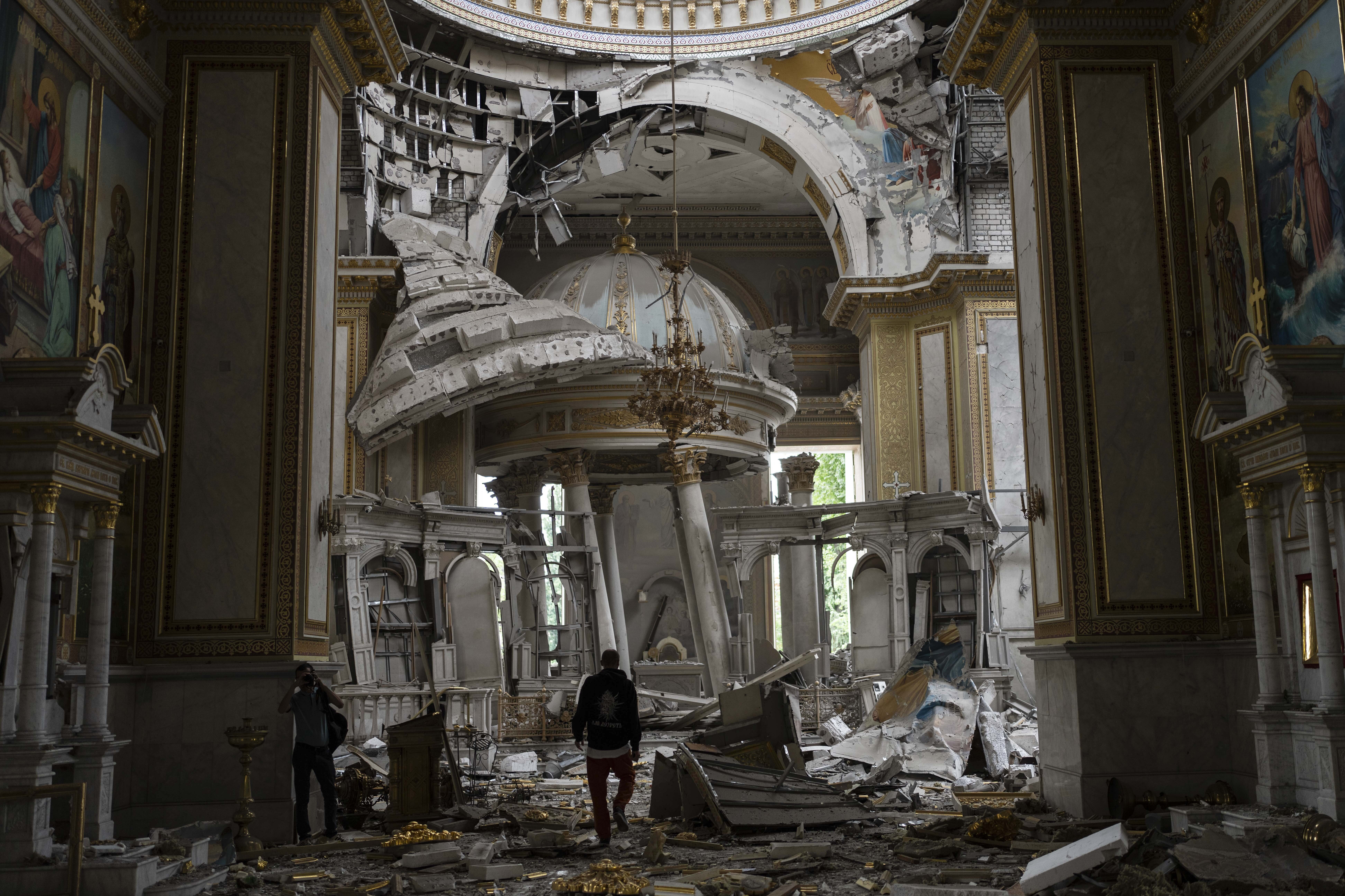 Church personnel inspect damages inside the Odesa Transfiguration Cathedral in Odesa, Ukraine. Photo / AP