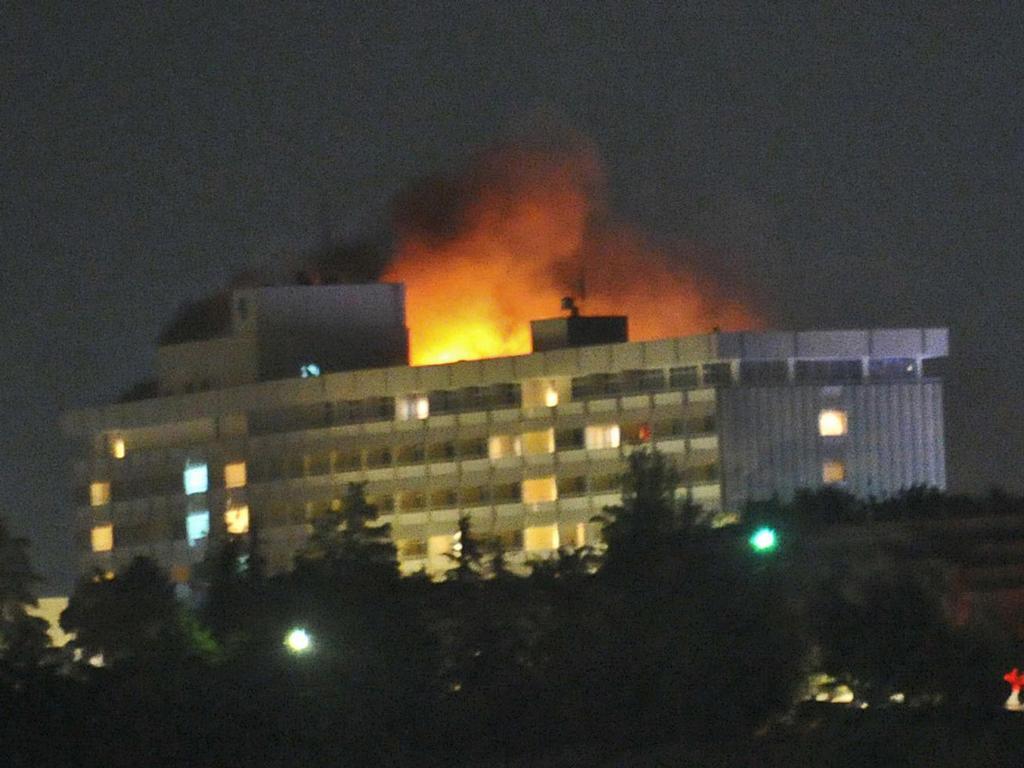 Smoke and flames light up the night at the Intercontinental hotel in Kabul, during the 2011 battle. Photo / AP