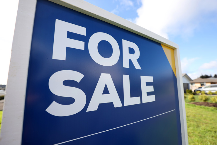 A for sale sign outside a house in Auckland. Fewer sales and lower prices this year have hit agents hard. Photo / Fiona Goodall