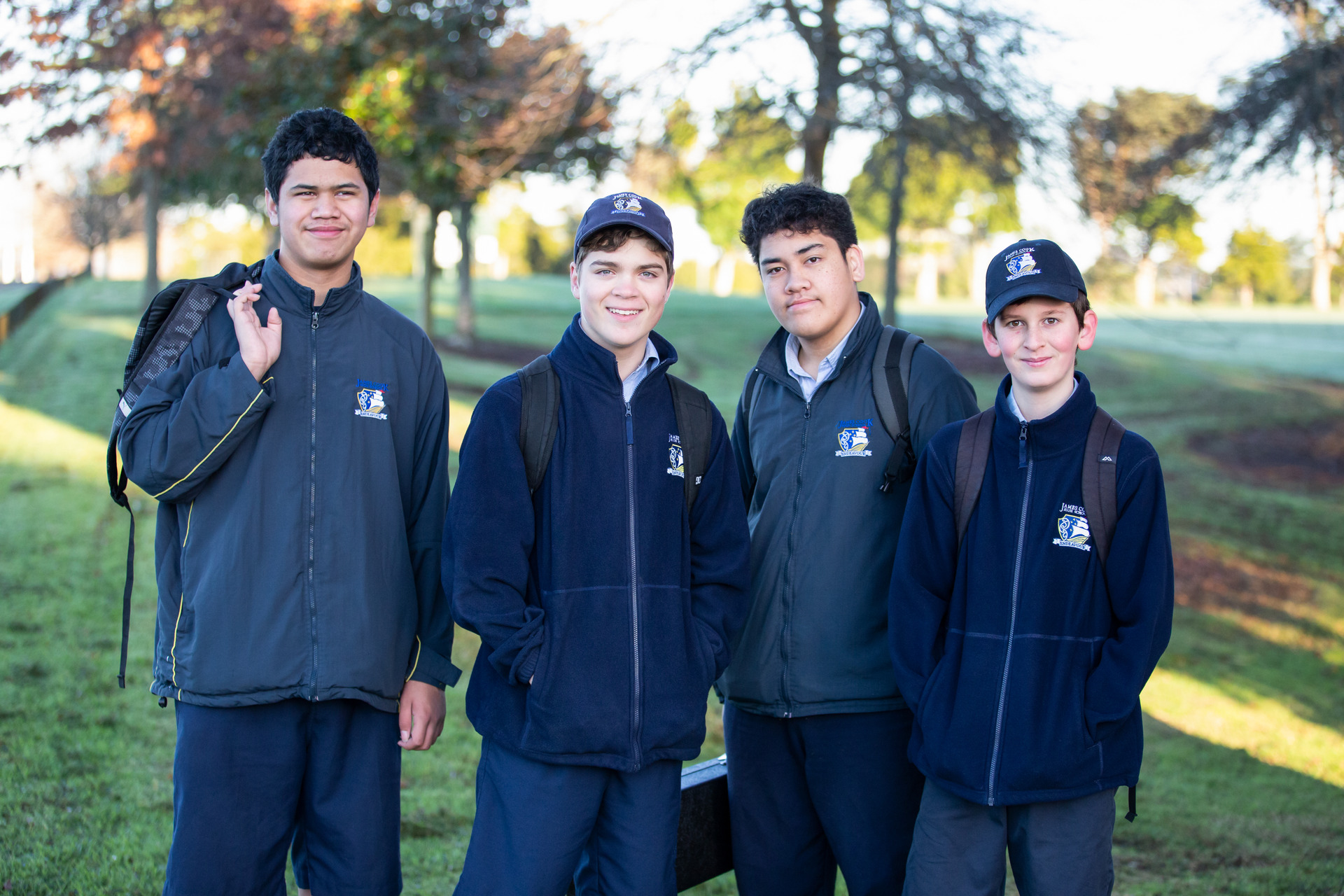 Joshua Diack (second from left) enjoys going to his local school, James Cook High. Photo / supplied