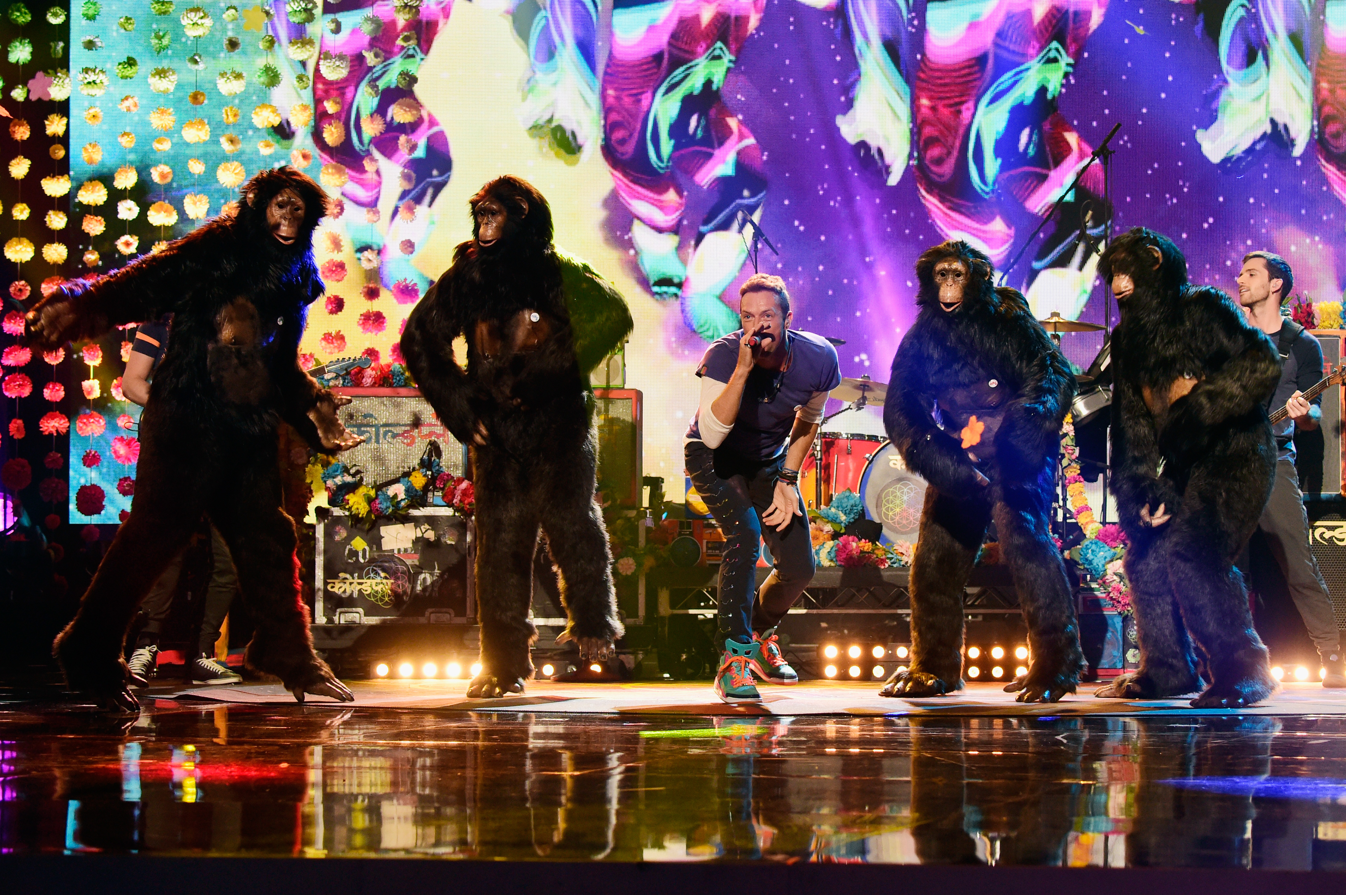Gorillas surround Chris Martin at the American Music Awards