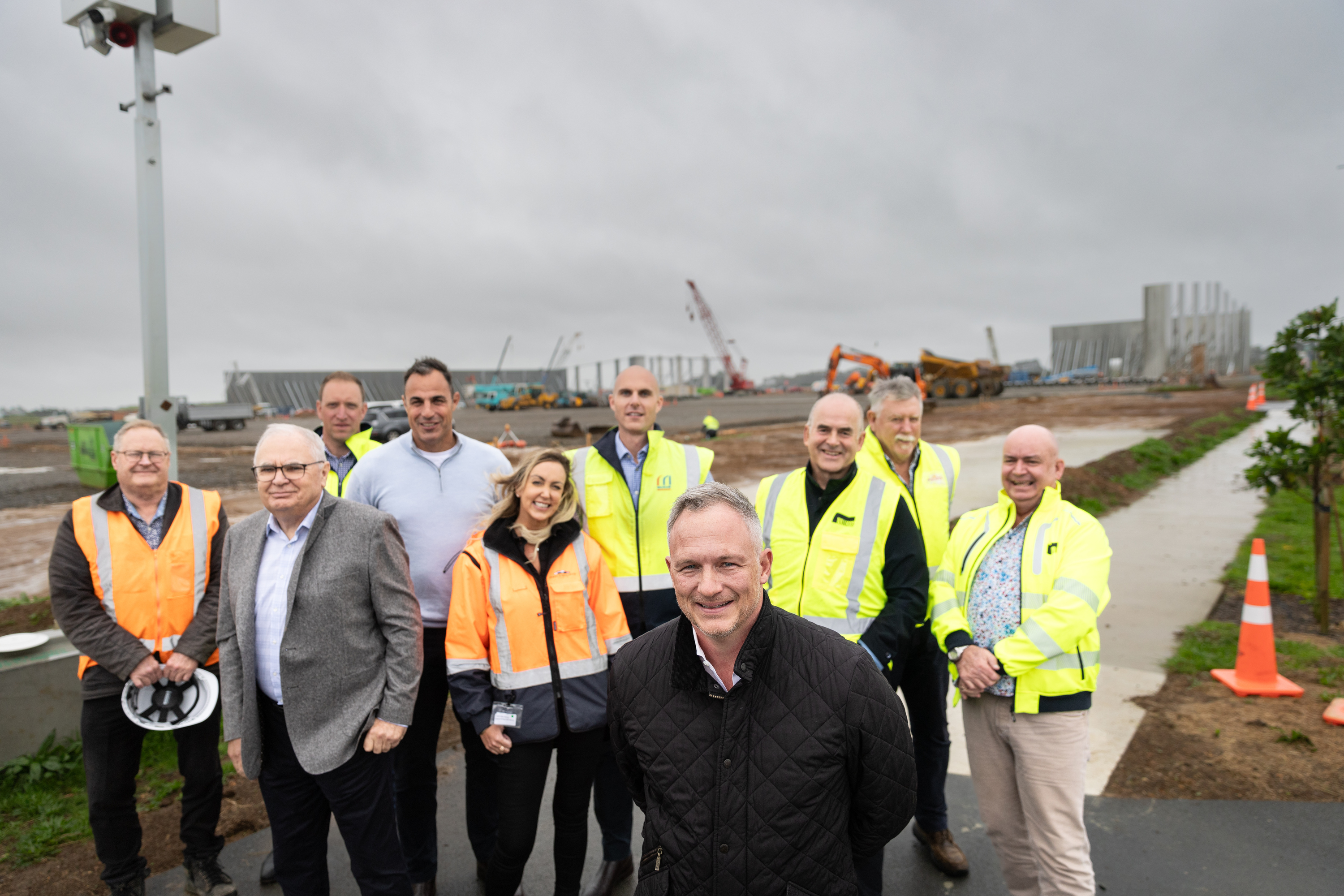 James Kirkpatrick Jnr CEO & managing director, (front black jacket). Left to Right behind Tony Day (Day Consulting); Sam Gordon (Macrennie Construction); Russell Bartlett (KC); Hamish Firth (Mt Hobson Group); Aoife Mac Sharry (JKGL); Michael White (Macrennie Construction); Simon Williams (Williams Architects); Mark Hellyer (JKGL); Quenten Pilgrem (Williams Architects) at 354 Puhinui Rd, James Kirkpatrick Group industrial land development park. Photo / Michael Craig