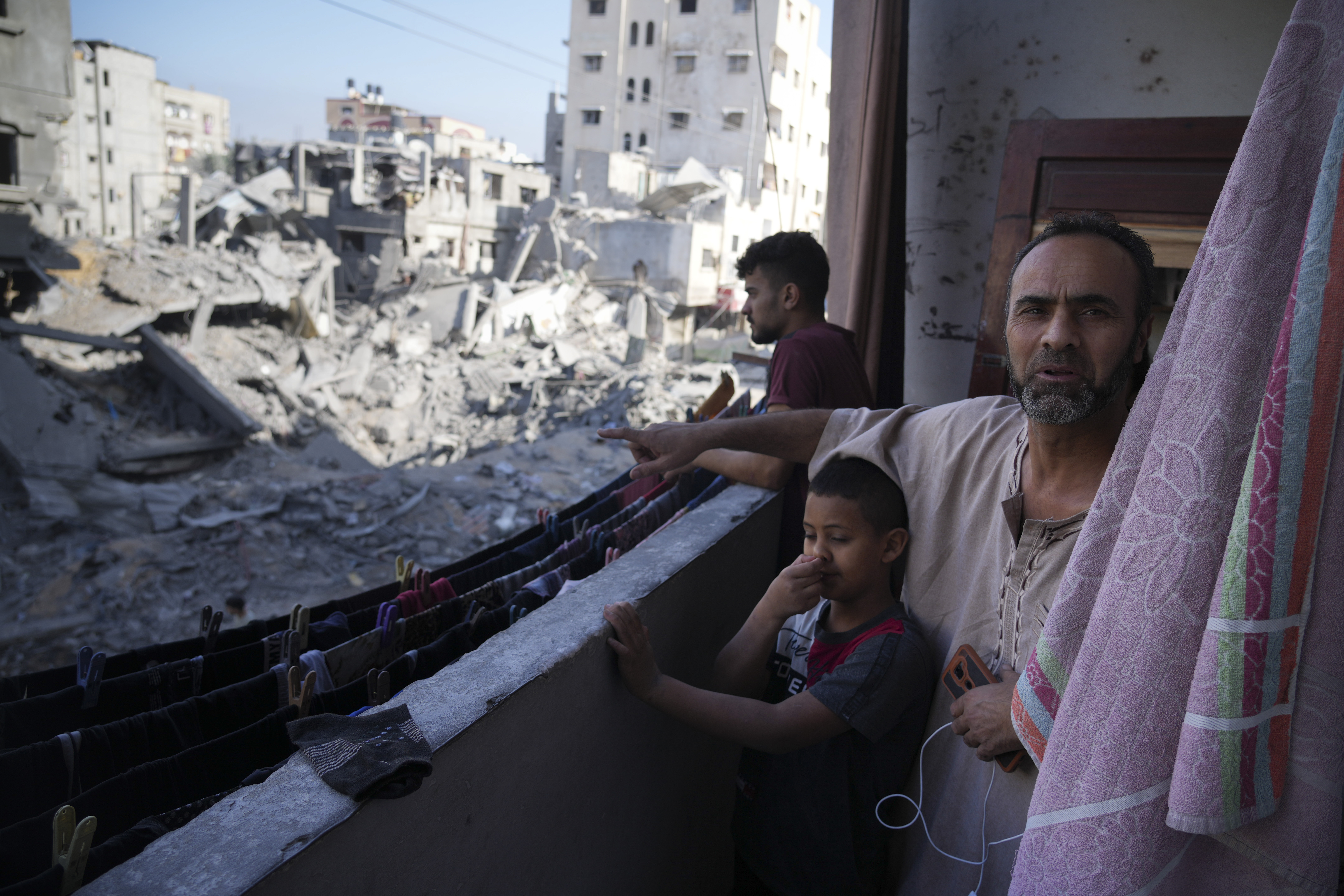 Palestinian points at destruction by the Israeli bombardment of the Gaza Strip in the Maghazi refugee camp. Photo / AP