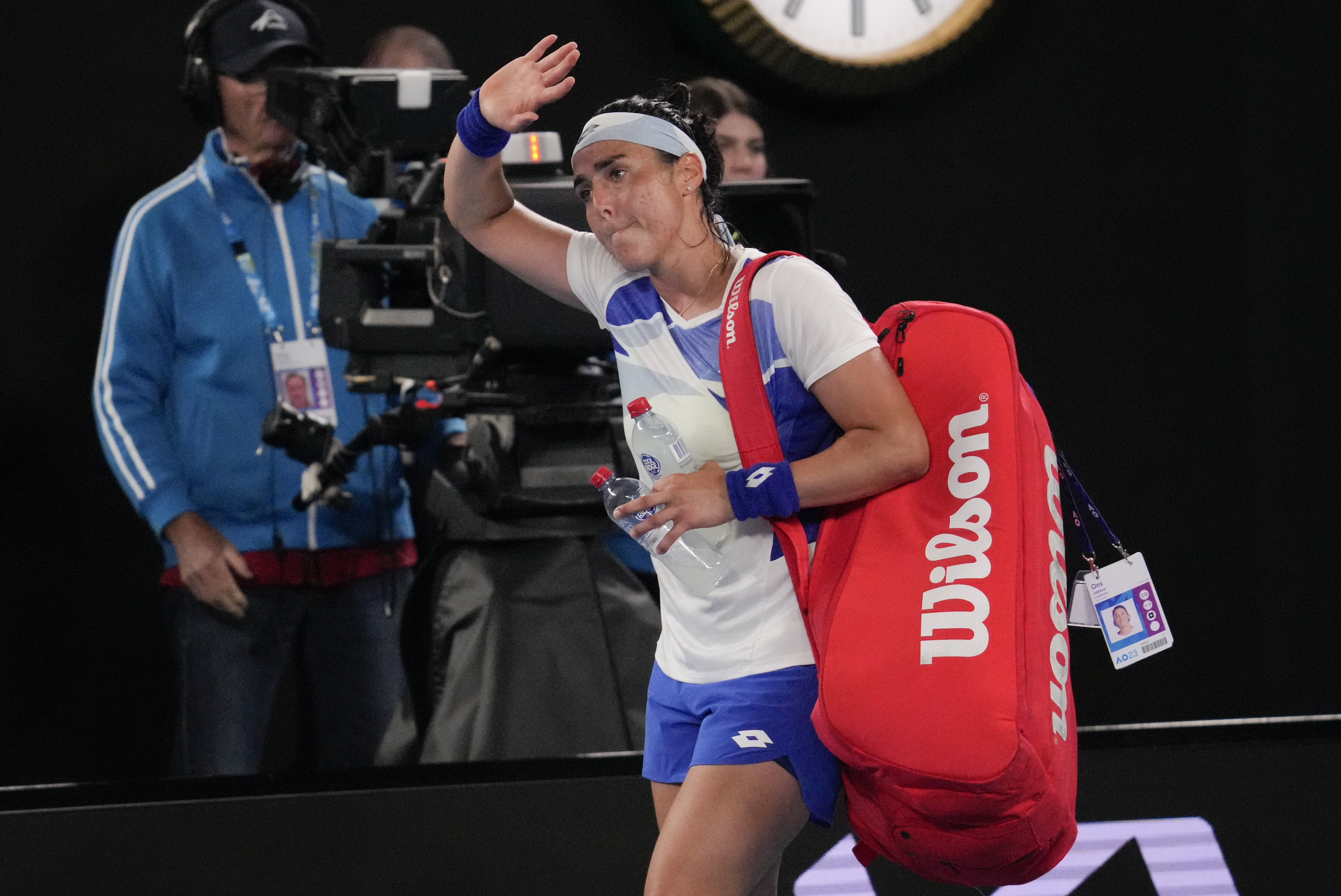 Ons Jabeur of Tunisia waves as she leaves Rod Laver Arena following her second round loss to Marketa Vondrousova. Photo / AP